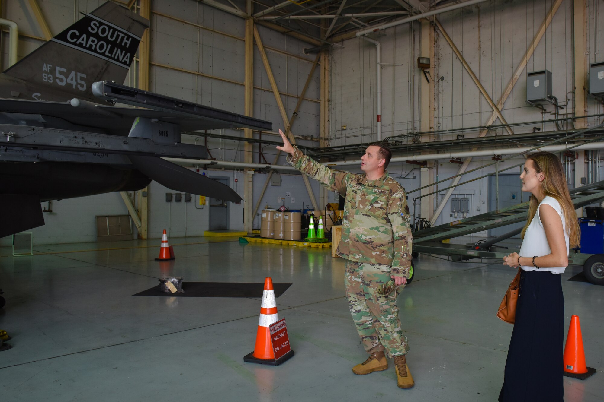U.S. Air Force Tech. Sgt. Justin Cayton, a production recruiter for the 169th Fighter Wing, speaks to Ashley Spivey, a potential recruit, and provides a tour of the South Carolina Air National Guard at McEntire Joint National Guard Base on August 17, 2020. Cayton utilizes base tours in order to educate potential applicants on opportunities within the South Carolina Air National Guard.  (U.S. Air National Guard photo by Senior Airman Mackenzie Bacalzo, 169th Fighter Wing Public Affairs)