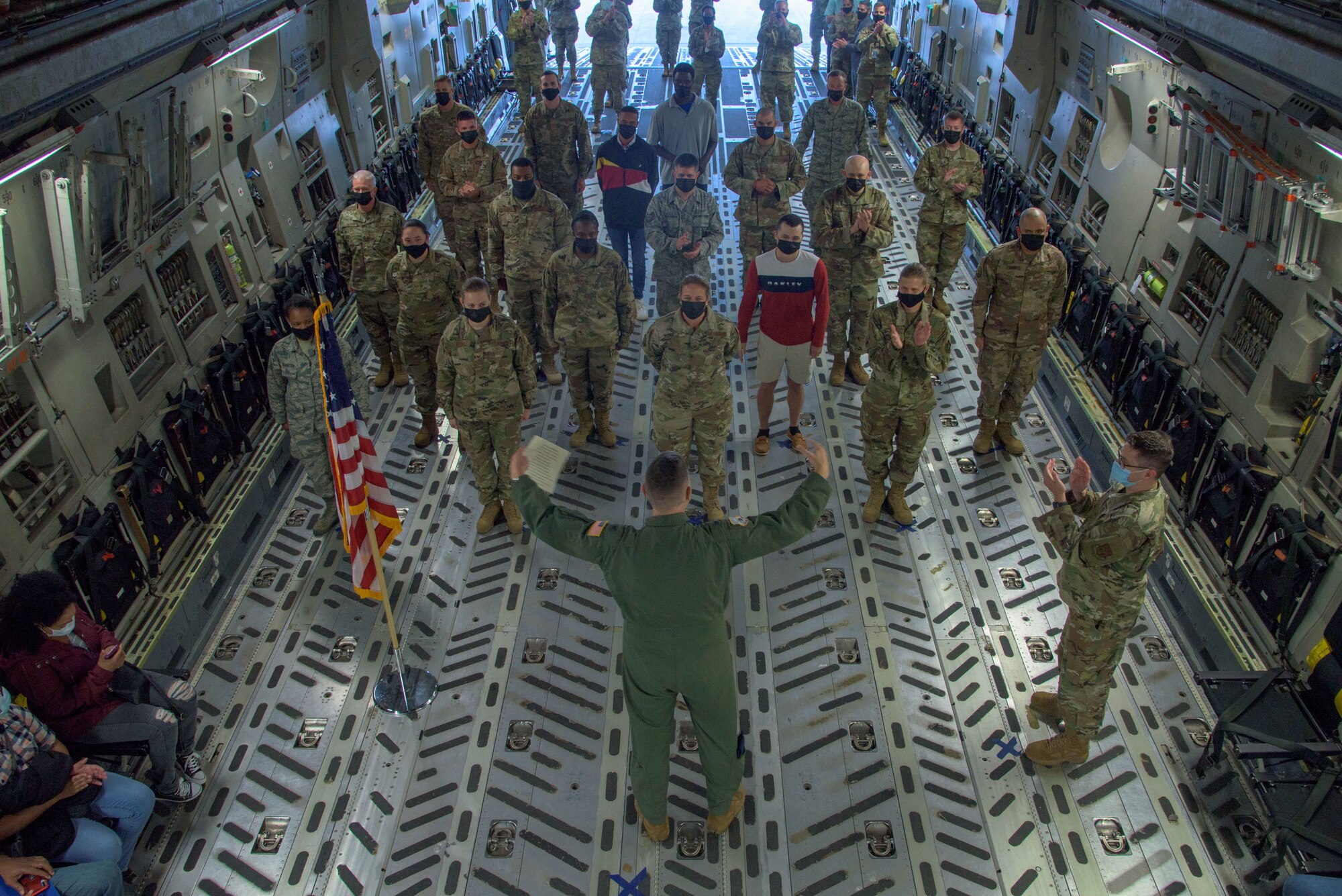 Col. Don Thigpen, Vice Commander of the 315th Airlift Wing, Joint Base Charleston, S.C. congratulates members of the 315th AW after they affirm or reaffirm their commitment to the United States Air Force Reserve Oct. 4, 2020. The oath of enlistment ceremony took place on a C-17 Globemaster III.