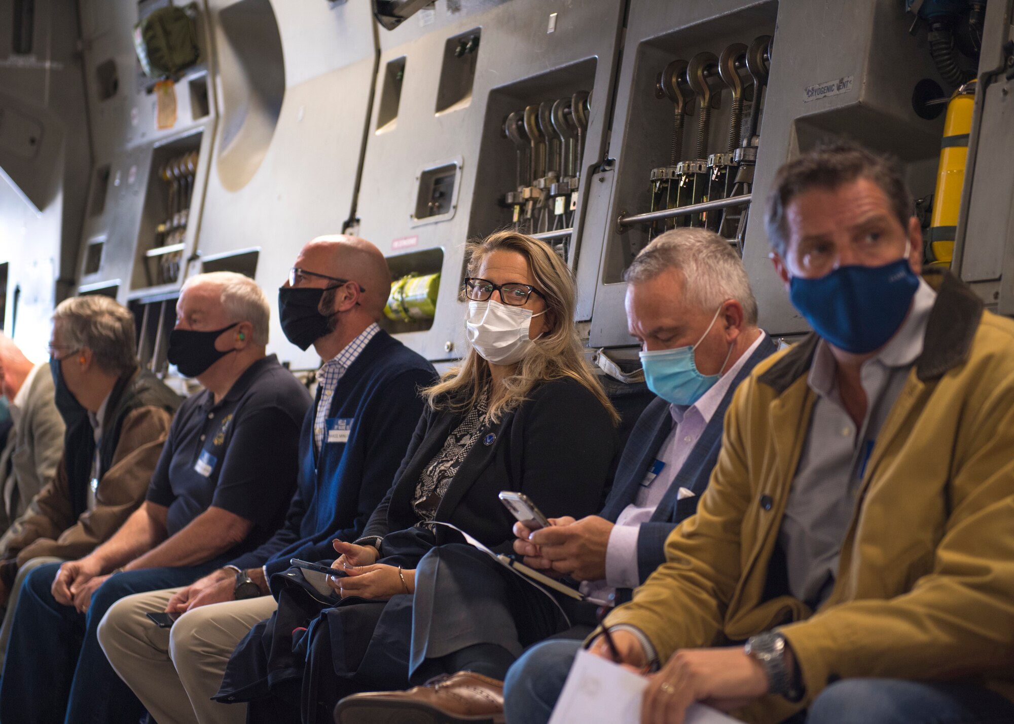 Pittsburgh-area civic leaders await instruction from the flight crew of a C-17 Globemaster III assigned to the 911th Airlift Wing at the Pittsburgh International Airport Air Reserve Station, Pennsylvania, Oct. 1, 2020.