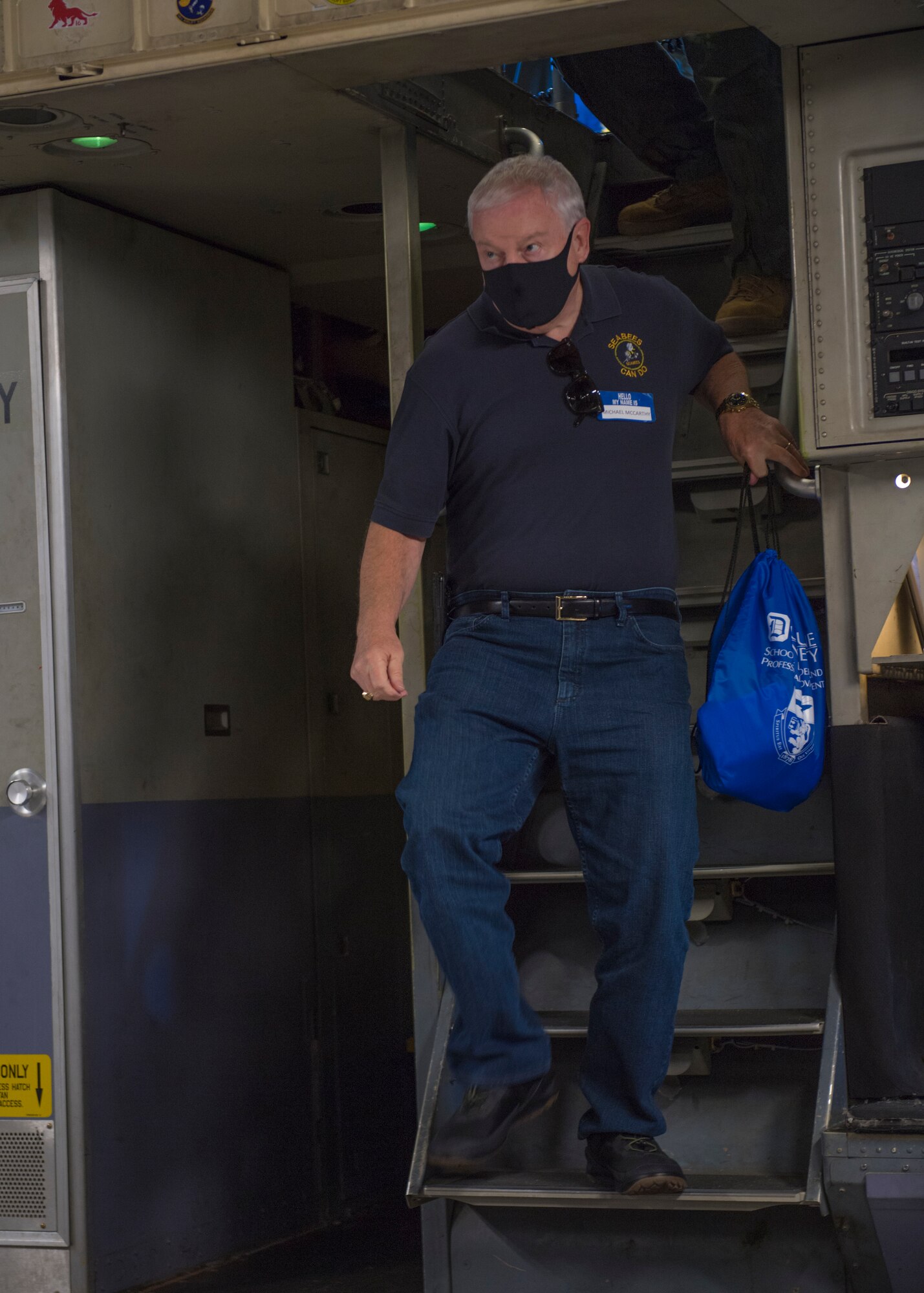 Michael E. McCarthy, judge with the Court of Common Pleas Fifth Judicial District Orphans’ Division in Pittsburgh, descends the stairs from the flight deck of a C-17 Globemaster III assigned to the 911th Airlift Wing during a flight over the state of Pennsylvania, Oct. 1, 2020.