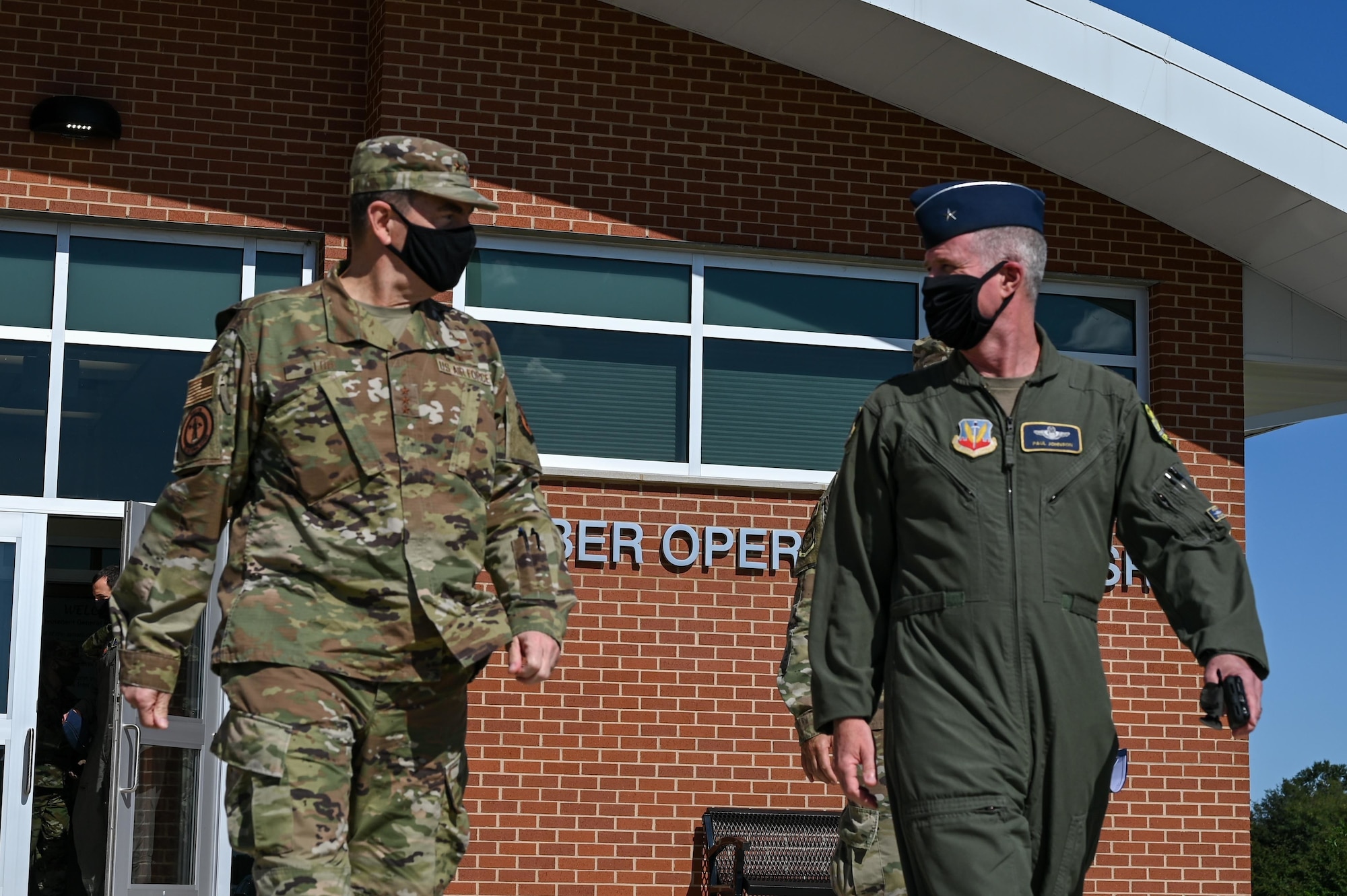 U.S. Air Force Lt. Gen. Michael A. Loh, the 13th director of the Air National Guard, walks alongside U.S. Air Force Brig. Gen. Paul Johnson, commander of the 175th Wing, Oct. 3, 2020, at Warfield Air National Guard Base, Middle River, Md. Loh and Johnson just visited the newly built Cyber Operations and Intelligence Surveillance and Reconnaissance building following a cyber mission brief.  (U.S. Air National Guard photo by Senior Airman Sarah M. McClanahan)