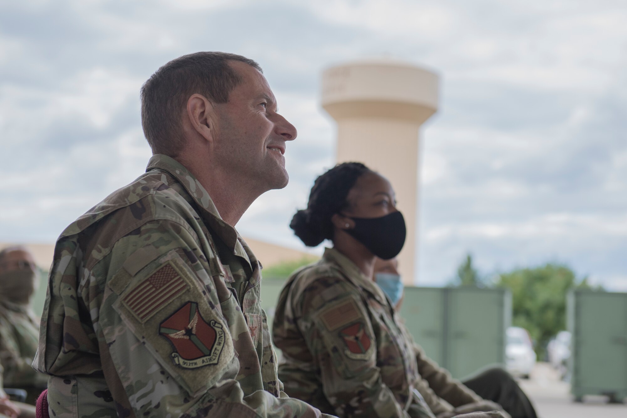 Col. John Robinson, commander of the 911th Airlift Wing, and Chief Master Sgt. Jamesha Barnes, command chief of the 911th AW, watch the proceedings during an assumption of command ceremony at the Pittsburgh International Airport Air Reserve Station, Pennsylvania, Oct. 3. 2020.