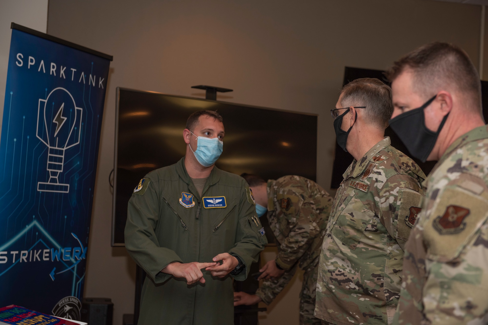 Maj. Anthony Bunker, 7th Bomb Wing Rapid Capabilities director, left, briefs Gen. Tim Ray, Air Force Global Strike Command commander, middle, and Chief Master Sgt. Charles Hoffman, AFGSC command chief, at Dyess Air Force Base, Texas, Sept. 30, 2020. The Rapid Capabilities office provides Dyess Airmen with the encouragement and resources needed to breed innovation. (U.S. Air Force photo by Airman 1st Class Colin Hollowell)