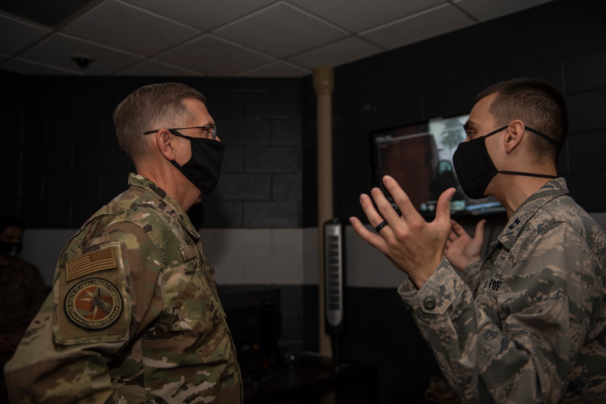 Capt. Simon Peña, 7th Force Support Squadron military personnel flight commander, right, briefs Gen. Tim Ray, Air Force Global Strike Command commander, at Dyess Air Force Base, Texas, Sept. 30, 2020. Peña briefed Ray on the Dyess esports room that was recently stood up at the base fitness center. Dyess esports provides Airmen with a location to compete in individual and team-based video game competitions. (U.S. Air Force photo by Airman 1st Class Colin Hollowell)
