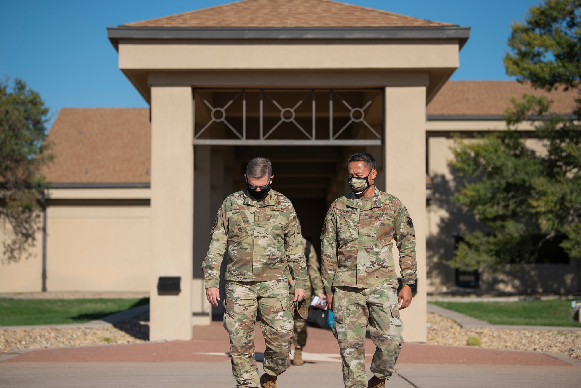 Col. Ed Sumangil, 7th Bomb Wing commander, right, talks to Gen. Tim Ray, Air Force Global Strike Command commander, at Dyess Air Force Base, Texas, Sept. 30, 2020. Ray was stationed at Dyess AFB from July 2006 to June 2008, where he served as the 7th BW commander. (U.S. Air Force photo by Airman 1st Class Colin Hollowell)