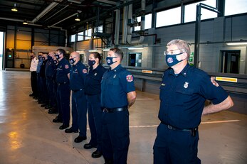 Firefighters from the 423rd Civil Engineer Squadron, stand in formation during a fire safety proclamation signing at RAF Alconbury, England, Oct. 5, 2020. U.S. Air Force Col. Richard Martin, 423rd Air Base Group commander, proclaimed Oct.5-9 as Fire Prevention week, which is designed to honor the sacrifices of our firefighters and teach fire safety to others. (U.S. Air Force photo by Senior Airman Eugene Oliver)