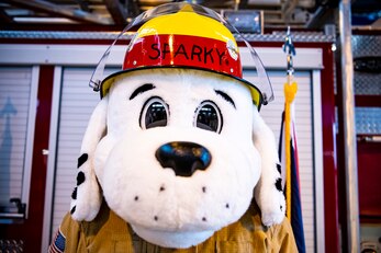 Sparky, 423rd Air Base Group mascot, poses for a photo during a fire proclamation signing at RAF Alconbury, England, Oct. 5, 2020. U.S. Air Force Col. Richard Martin, 423rd ABG commander, proclaimed Oct.5-9 as Fire Prevention week, which is designed to honor the sacrifices of our firefighters and teach fire safety to others. (U.S. Air Force photo by Senior Airman Eugene Oliver)