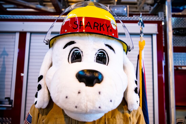 Sparky, 423rd Air Base Group mascot, poses for a photo during a fire proclamation signing at RAF Alconbury, England, Oct. 5, 2020. U.S. Air Force Col. Richard Martin, 423rd ABG commander, proclaimed Oct.5-9 as Fire Prevention week, which is designed to honor the sacrifices of our firefighters and teach fire safety to others. (U.S. Air Force photo by Senior Airman Eugene Oliver)