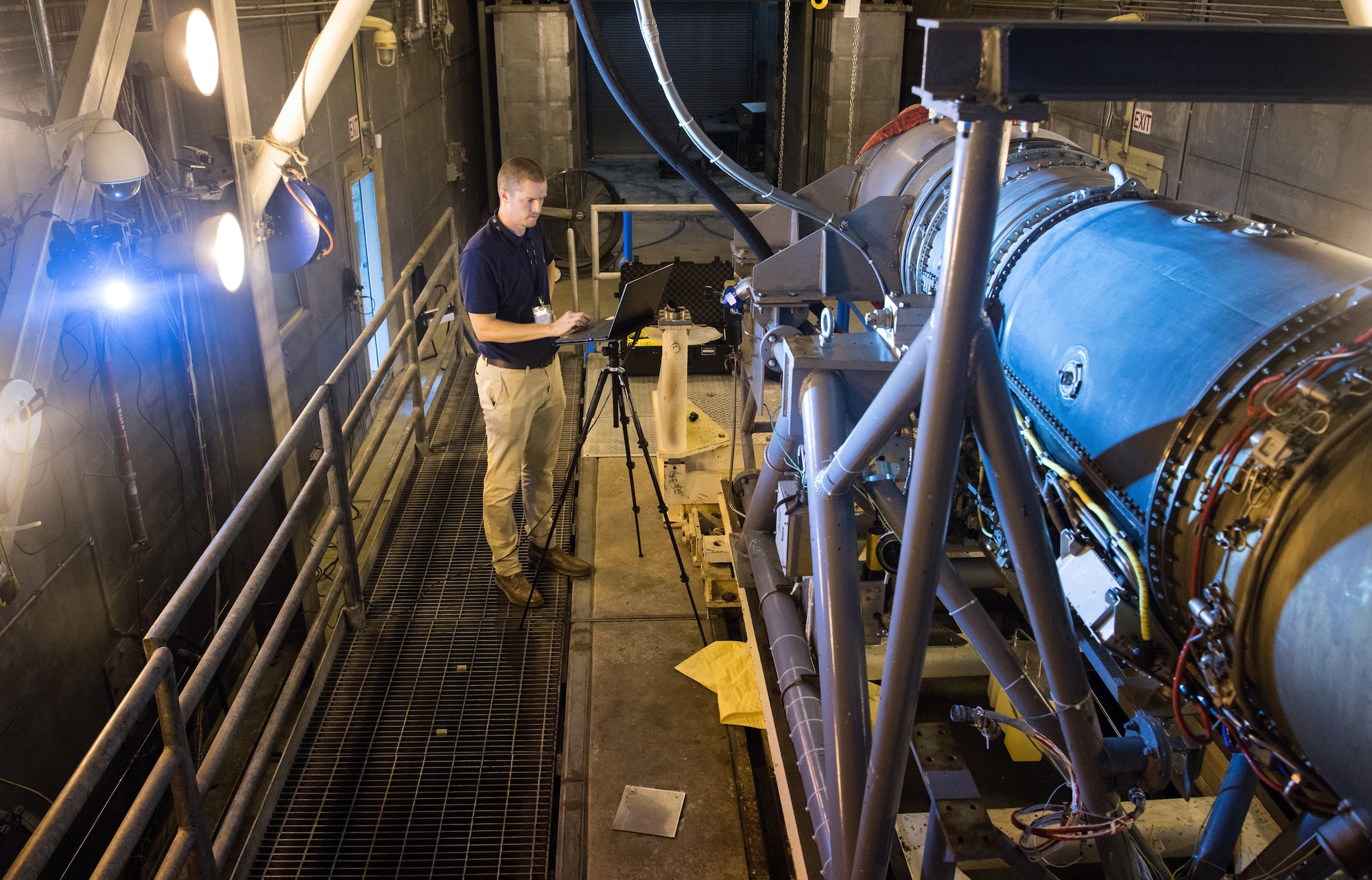 Seth Beaman, a Naval Air Systems Command aeropropulsion test analyst, uses a laptop to check the view of a high-speed camera, Sept. 1, 2020, in the sea-level test cell SL-1 at Arnold Air Force Base, Tenn. The camera, combined with software, allows for the observation and measurement of vibrations. Beaman is studying the potential for its use as an analysis tool for engine testing. (U.S. Air Force photo by Jill Pickett)