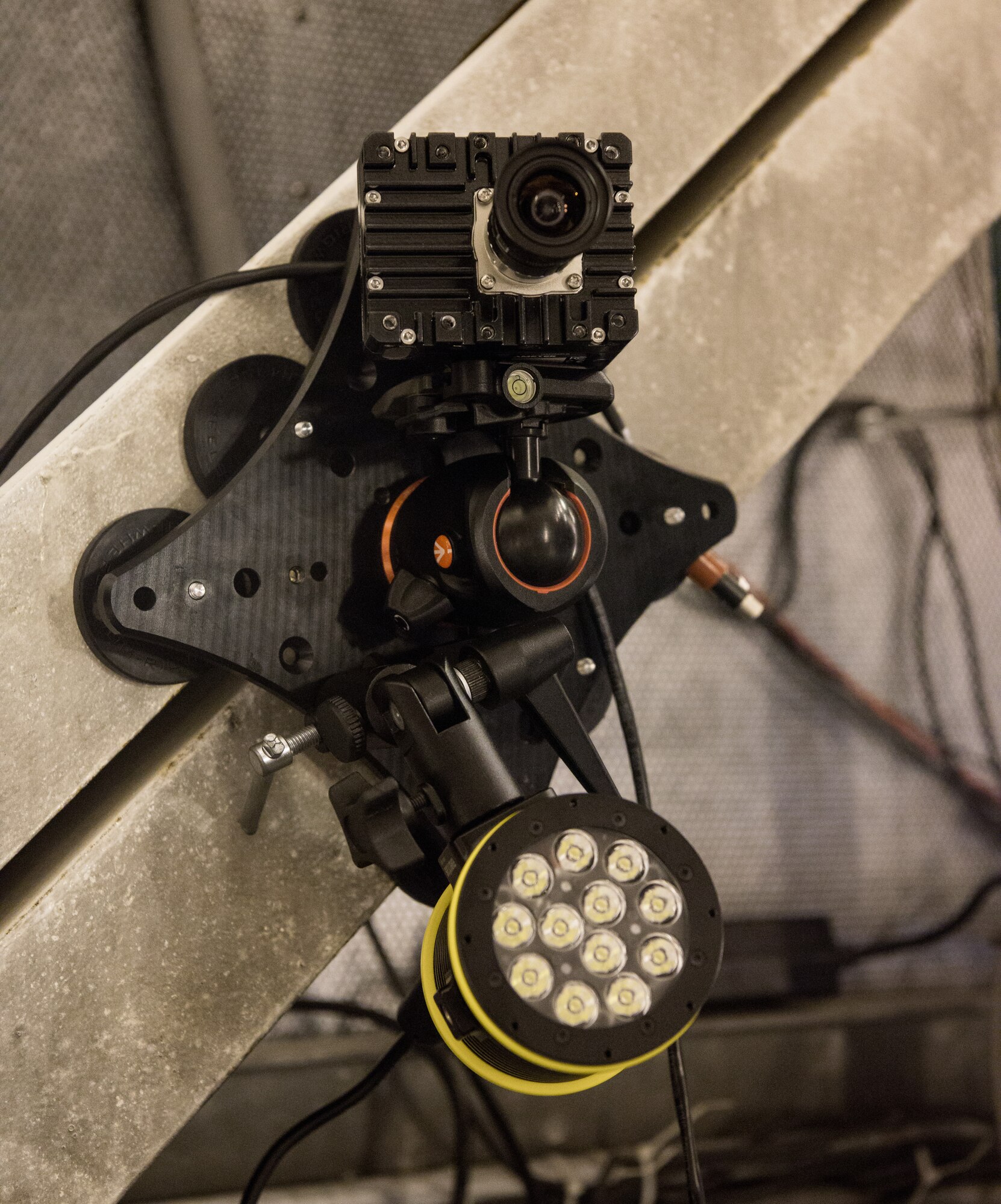 A high-speed camera is temporarily mounted in the sea-level test cell SL-1 using magnets, Sept. 1, 2020, at Arnold Air Force Base, Tenn. The camera combined with special software, allows for the observation and measurement of vibrations. The portability of the system is one of the benefits over the standard test cell cameras. (U.S. Air Force photo by Jill Pickett)