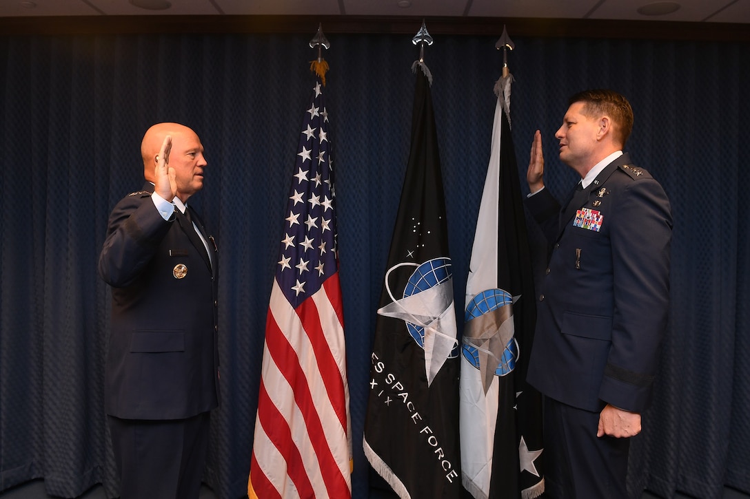 Chief of Space Operations General John Raymond promotes David Thompson to the rank of General during a ceremony in the Pentagon, Washington, D.C., Oct 1, 2020. (Air Force Photo by Andy Morataya)