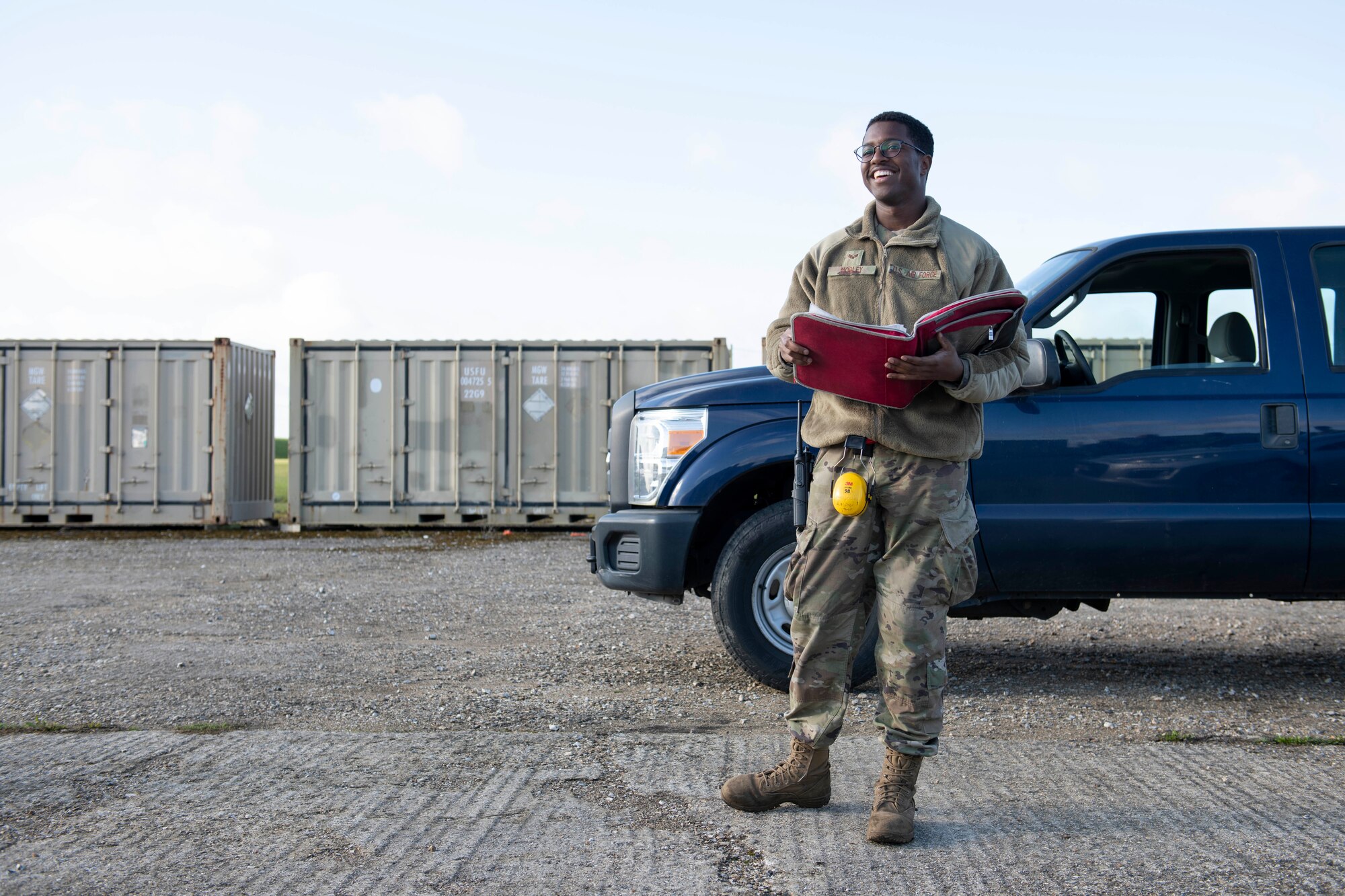 U.S. Air Force Senior Airman Andre Mobley, 420th Munitions Squadron stockpile technician, shares with Col. Kurt Wendt, 501st Combat Support Wing commander, information about the necessary cleaning and qualifications for explosive International Standards Organization (ISO) shipping containers, during a visit to RAF Welford, England, Oct. 1, 2020. Wendt visited 420th MUNS to meet with the Airmen and to learn more about their new mission capabilities. (U.S. Air Force photo by Senior Airman Jennifer Zima)