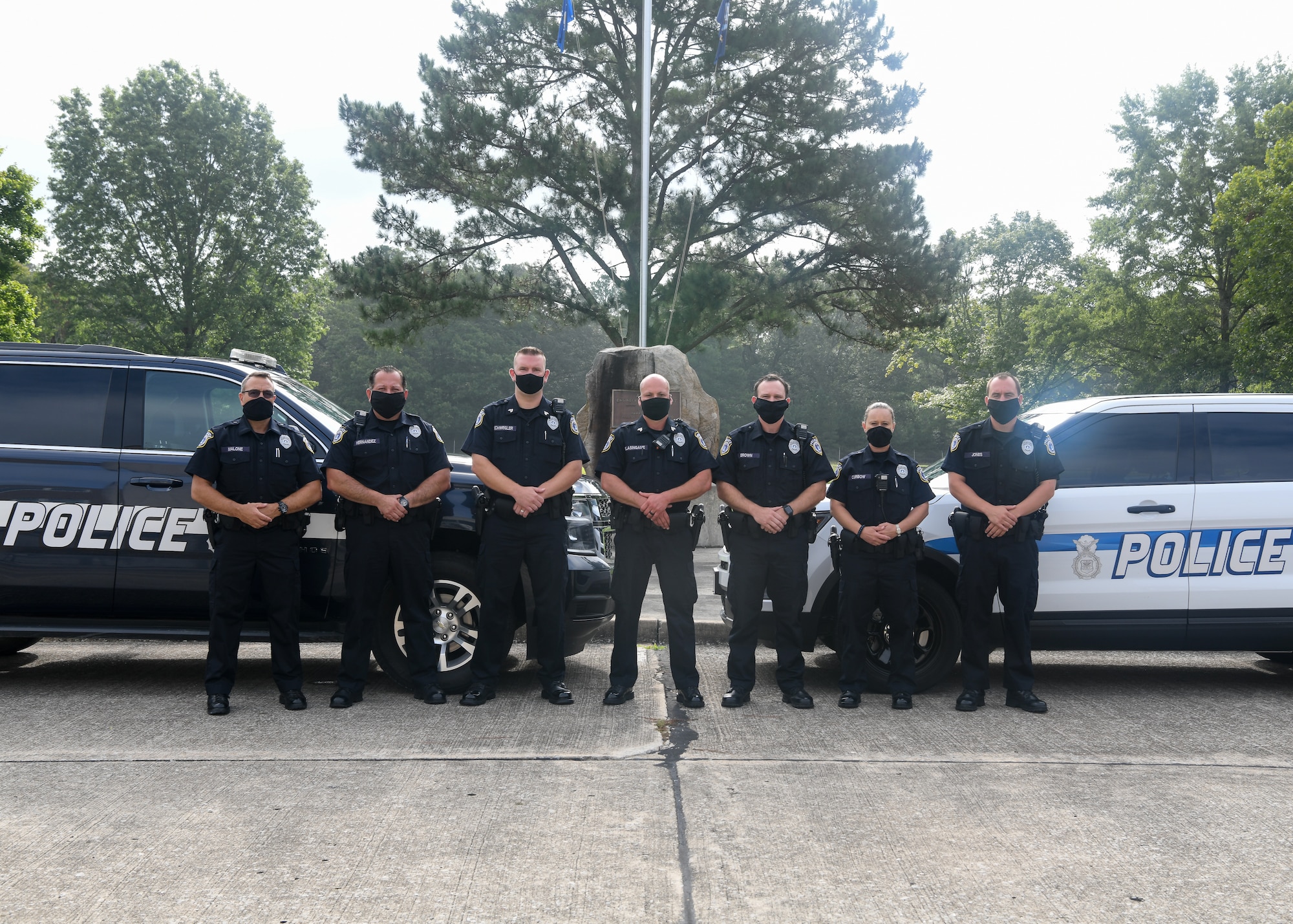 Department of the Air Force Police Officers pose for a photo Sept. 2, 2020, at Arnold Air Force Base, Tenn. Pictured are, from left, Officer Todd Malone, Officer Bill Hernandez, Sgt. Andy Scwegler, Sgt. George Blasingame, Officer Josh Brown, Officer Jennifer Curbow and Officer Derek Jones. (U.S. Air Force photo by Jill Pickett)