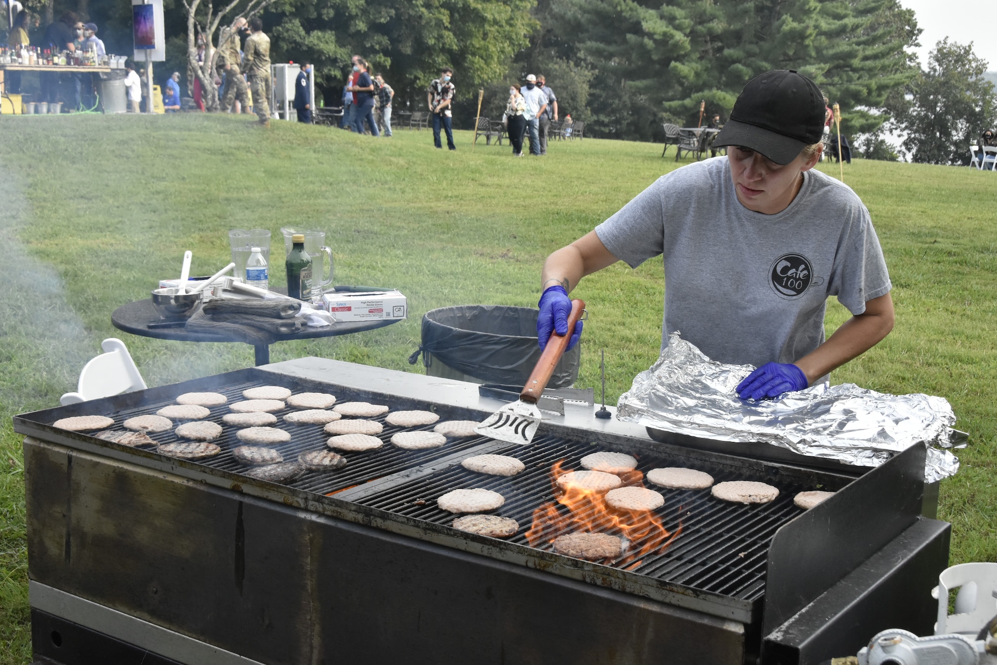Wende Pepper with Arnold Air Force Base Services grills burgers for the hungry attendees of the Sept. 18 Air Force birthday celebration at the Arnold Lakeside Complex on Arnold AFB. Dozens gathered to help mark the 73rd birthday of the Air Force, which was officially established on Sept. 18, 1947. (U.S. Air Force photo by Bradley Hicks)