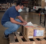 David Howard, a 502nd Centralized Cargo Operations, or CCO, maintainer at Joint Base San Antonio-Randolph, reviews a shipment work order Oct. 5. After the release of a shipment, the CCO tracks packages so the recipient knows when it will arrive.