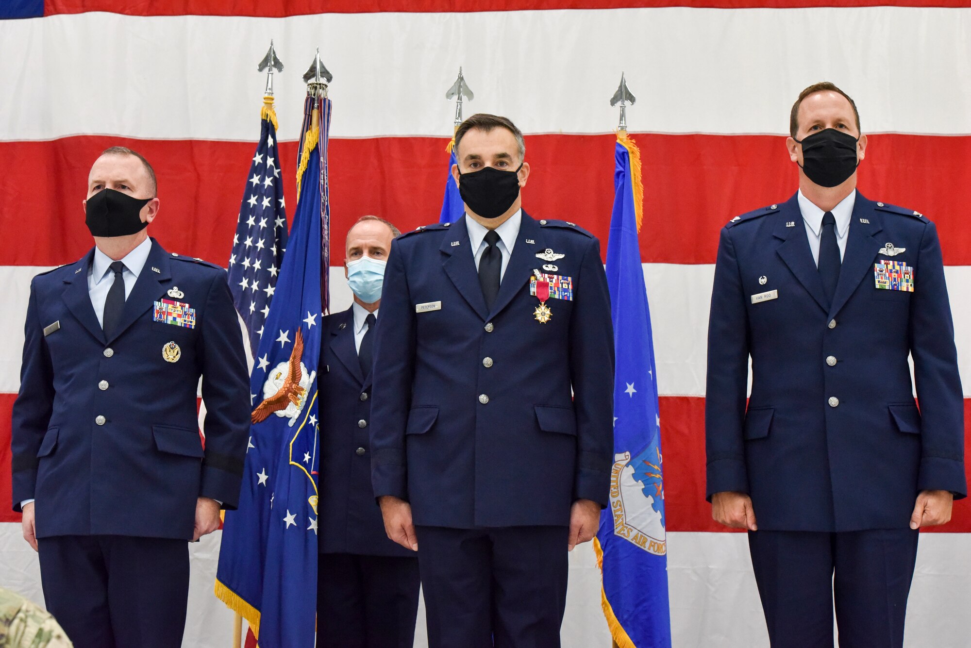 Brig. Gen. David May, Wisconsin’s deputy adjutant general for Air, Command Chief Master Sergeant James McKay, 115th Fighter Wing Command Chief, Brig. Gen. Erik Peterson, Chief of Staff, Wisconsin Air National Guard and Col. Bart Van Roo, 115th Fighter Wing commander stand-by prior to the passing of the unit flag as part of the official change of command ceremony in an aircraft hangar at the 115th Fighter Wing, Madison, Wis., Oct 3, 2020. Col. Bart Van Roo assumed command of the 115th Fighter Wing from Brig. Gen. Erik Peterson. (U.S. Air National Guard Photo by Tech. Sgt. Mary Greenwood)