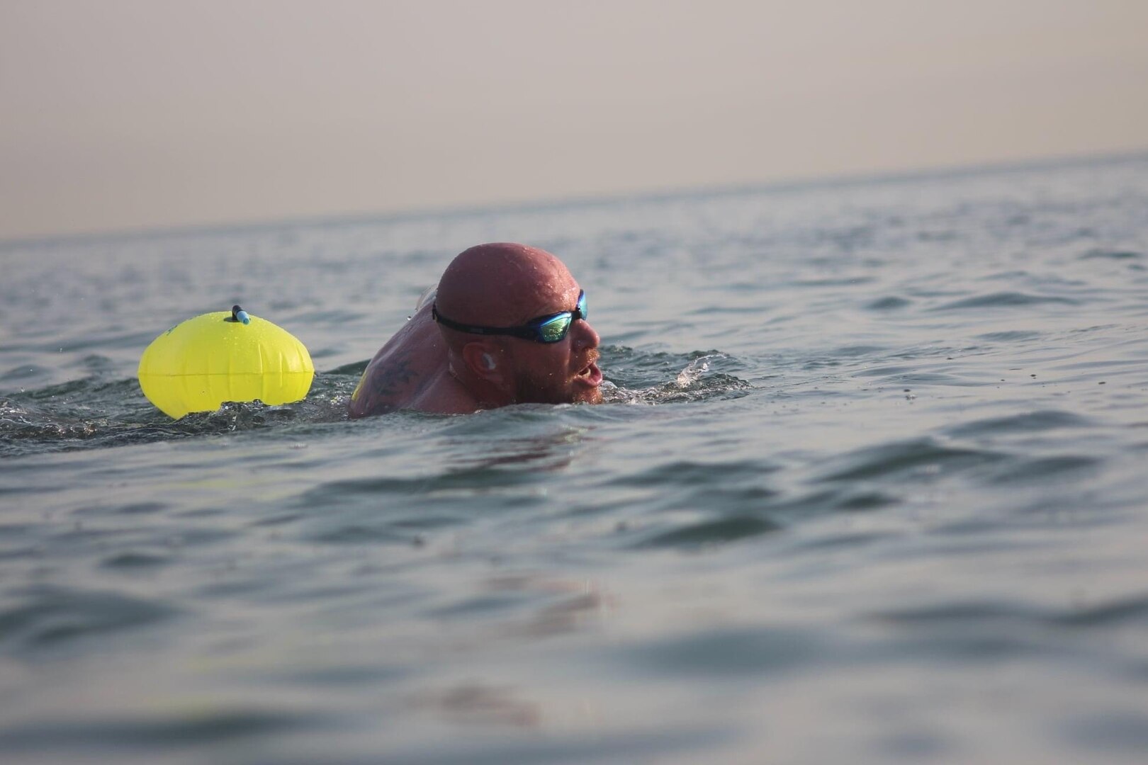 Eric Reich, Defense Logistics Agency Disposition Services’ operations supervisor and site lead, pushes himself on during the Sept. 18 swim competition.