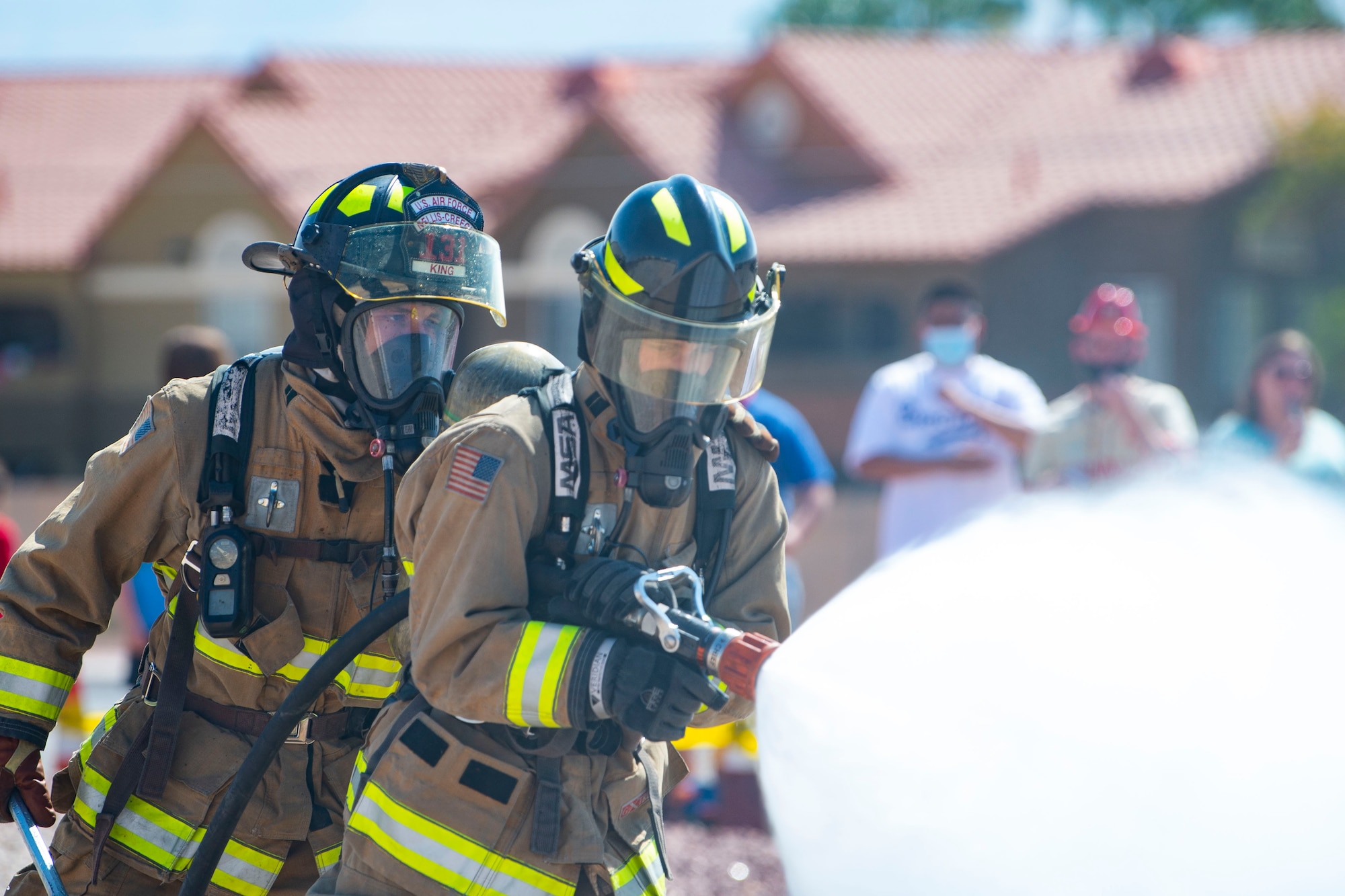 Firefighters extinguish car demonstration fire.