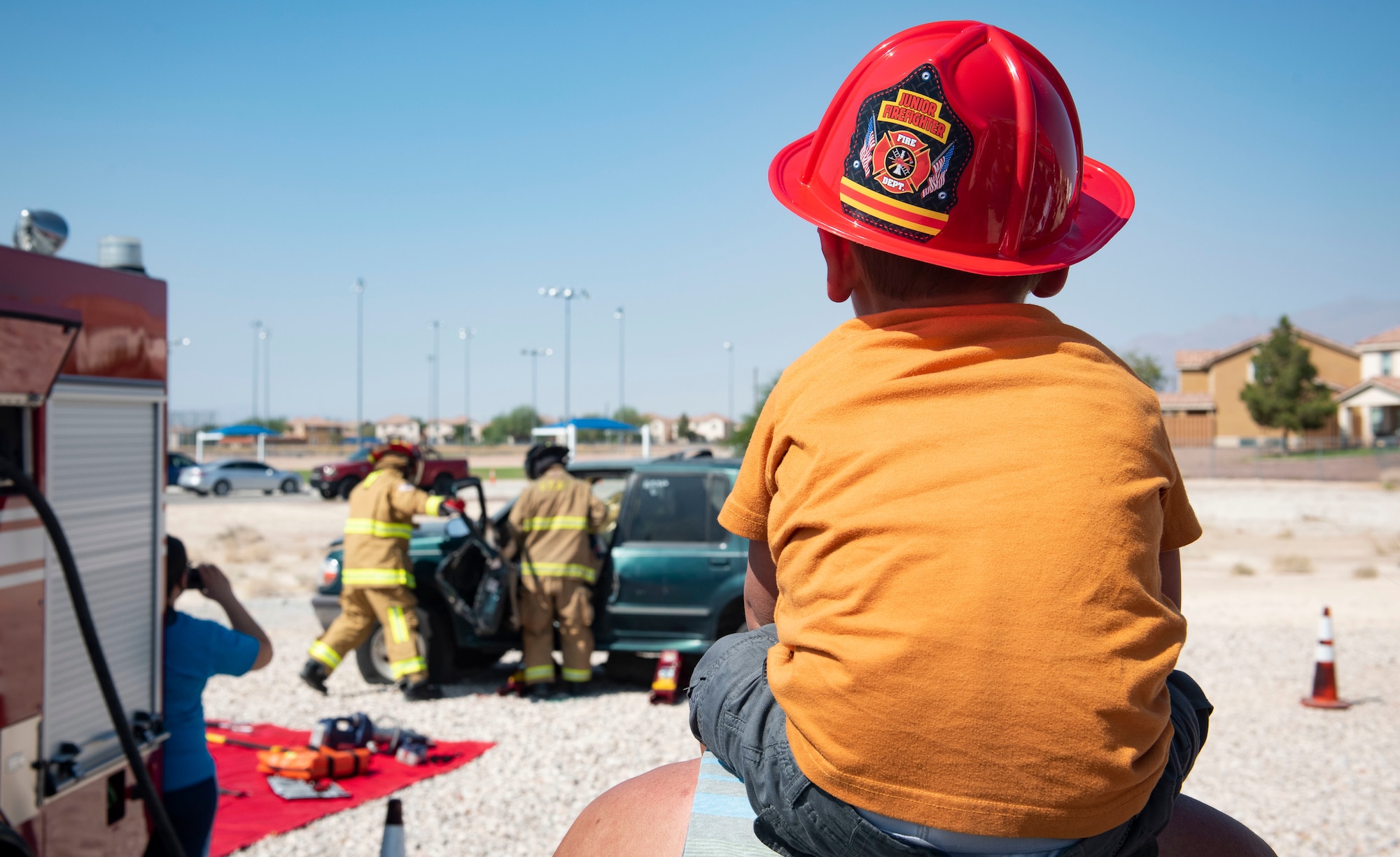 Junior firefighter watches demonstration