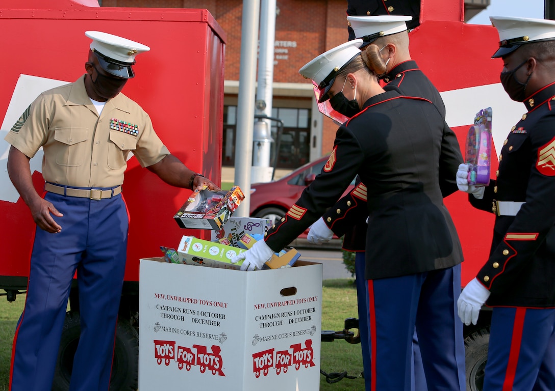 Staff Sgt. Tara Ballard, coordinator, Toys for Tots, and Capt. Rebecca Sullivan, commanding officer, Salvation Army, gathered aboard Marine Corps Logistics Base Albany to formally kickoff the 73rd annual Toys for Tots campaign, Oct. 2. (U.S. Marine Corps photo by Jennifer Parks)