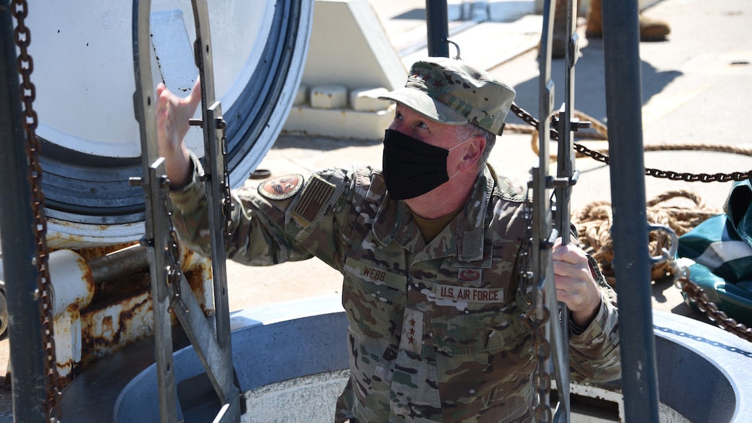 Lt. Gen. Brad Webb, commander of Air Education and Training Command, climbs out of a missile silo
