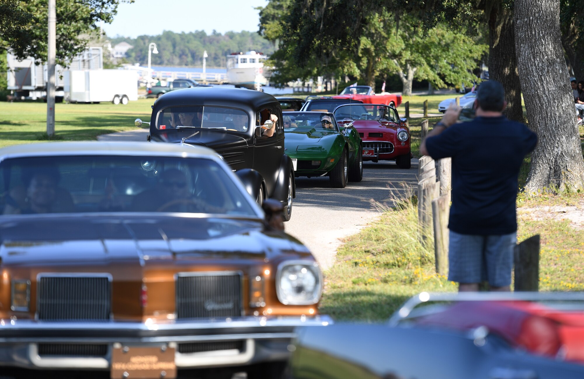 Classic vehicles participate in the 17th Annual Cruisin' Keesler Car Show - Parade Edition at Marina Park at Keesler Air Force Base, Mississippi, Oct. 3, 2020. The event is held to kick off Cruisin' the Coast, a festival to celebrate classic cars, trucks and hot rods, where vehicles cruise down the 30-mile beachside highway in Mississippi. (U.S. Air Force photo by Kemberly Groue)