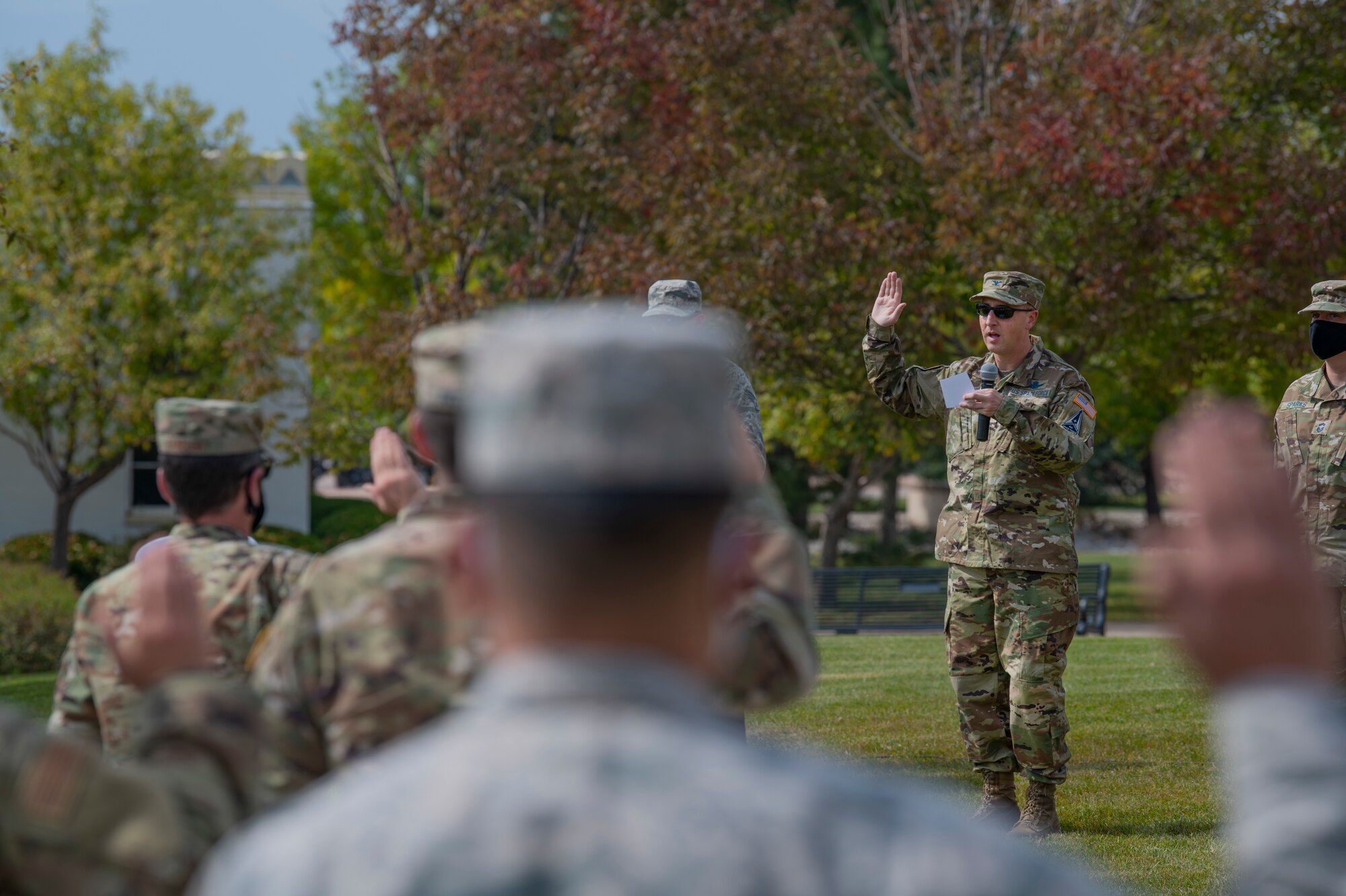 Delta 2 members recite the oath of enlistment and office during a transfer ceremony