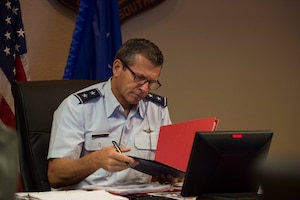 Airman looks at documents