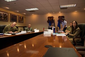 Air Force personnel participate in a virtual conference
