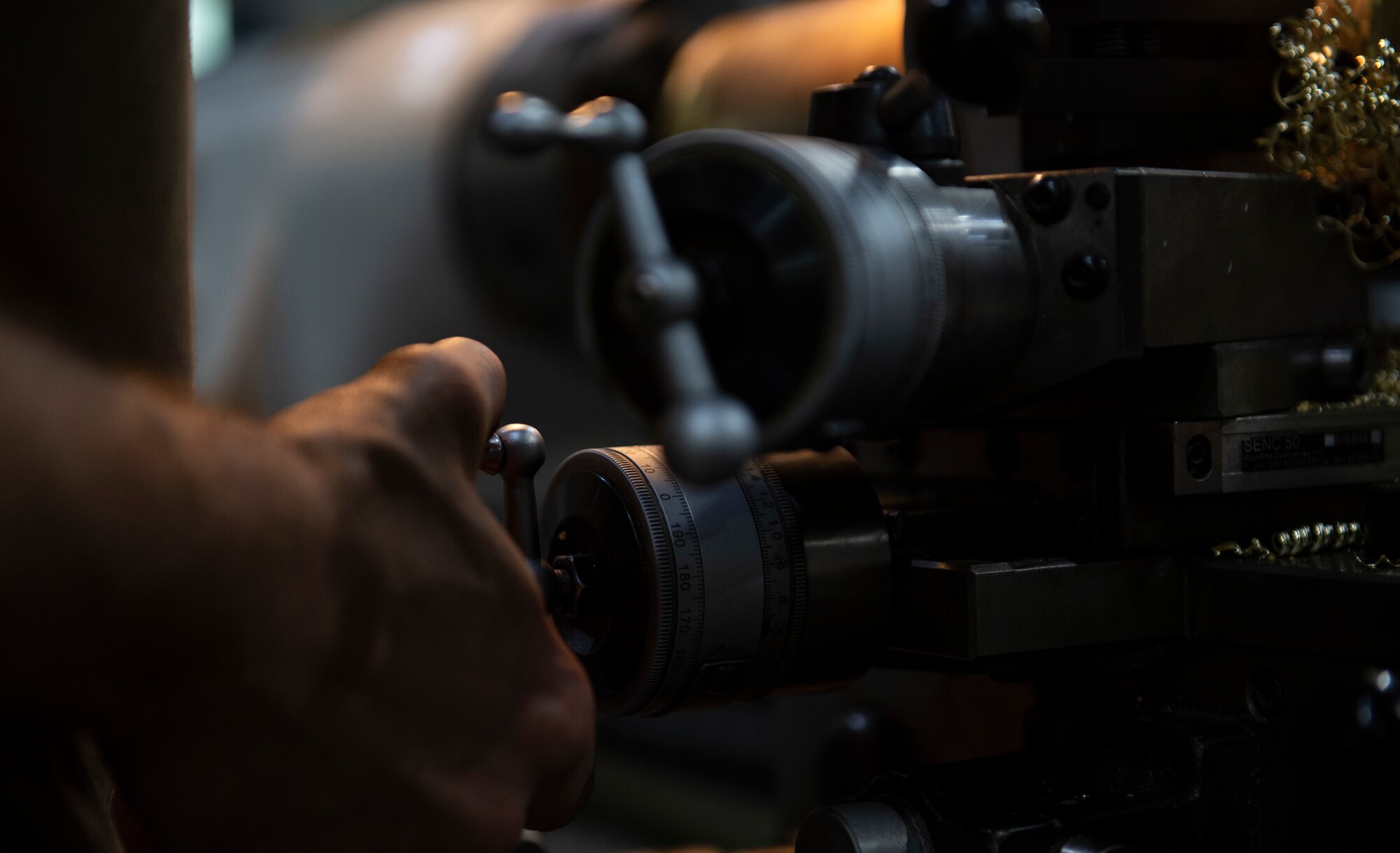 Tech. Sgt. Nathaniel Lowrey uses a lathe.