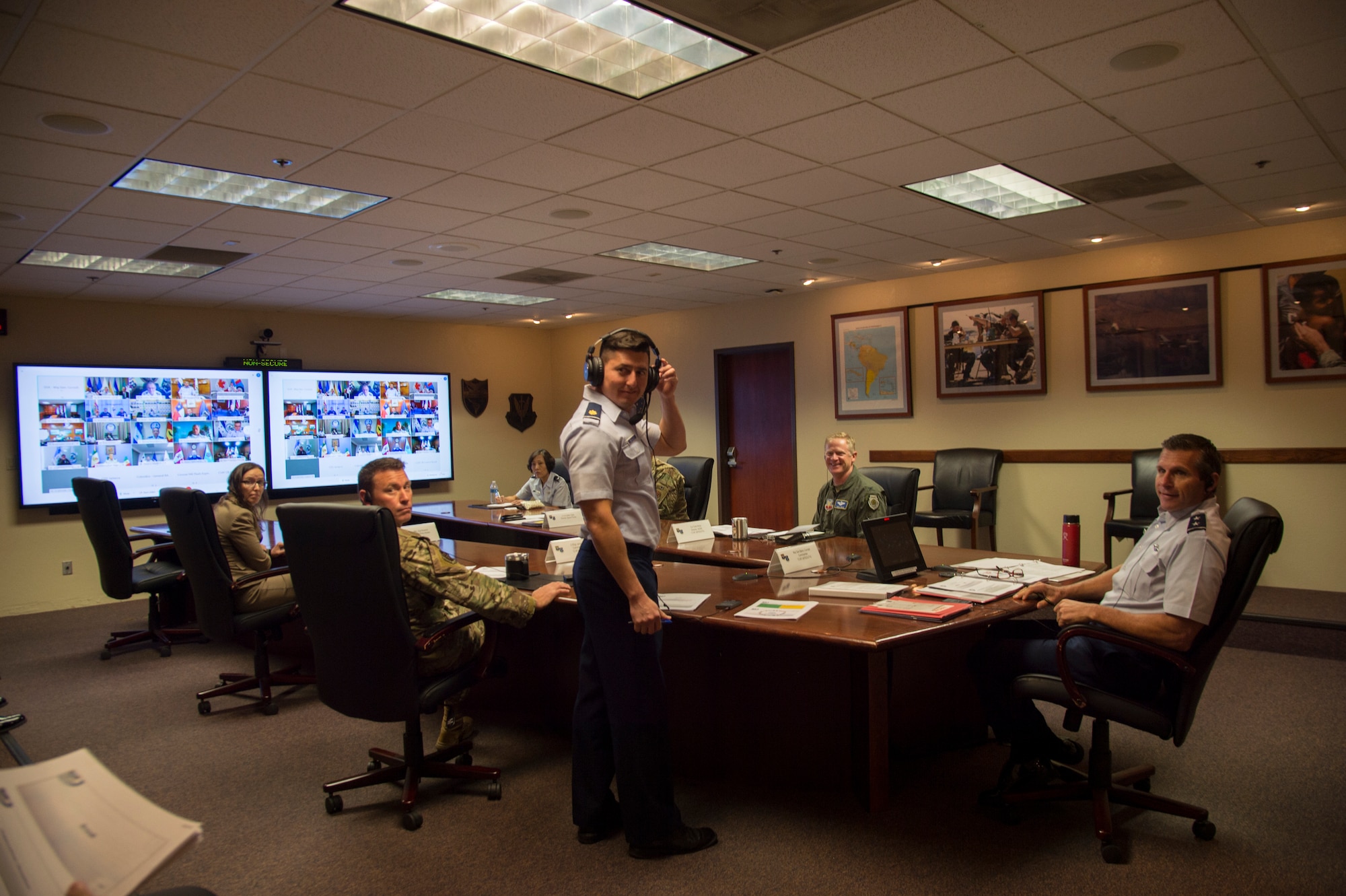 Airmen sit at virtual conference