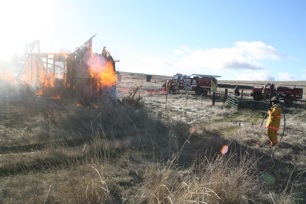 Jim Day puts out a structural fire during a training exercise as part of his volunteer fire fighting duties with High Prairie Fire and Rescue.