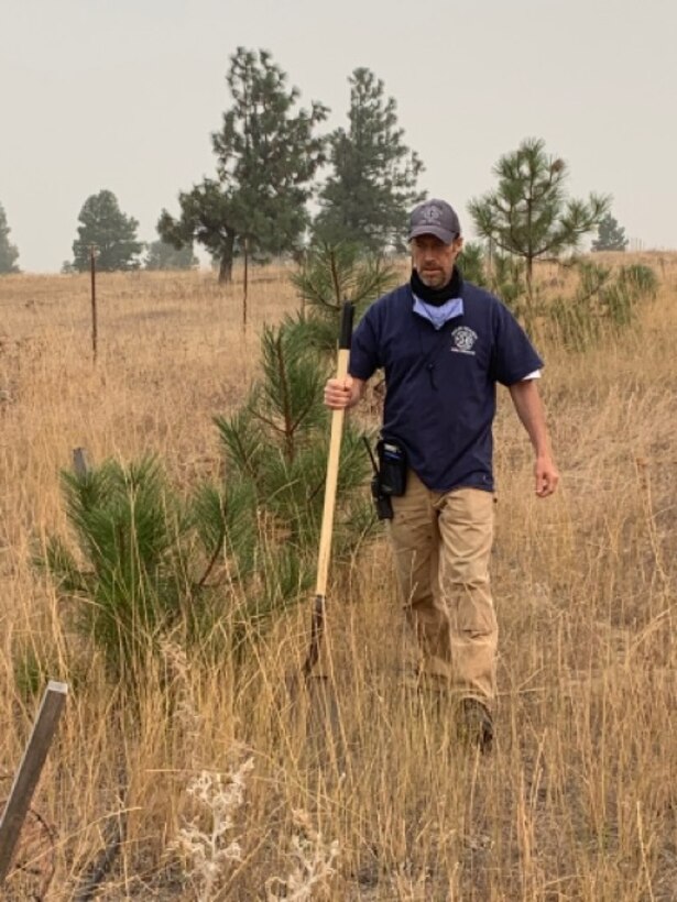 Jim Day replants healthy trees away from buildings as part of the Firewise program at High Prairie.