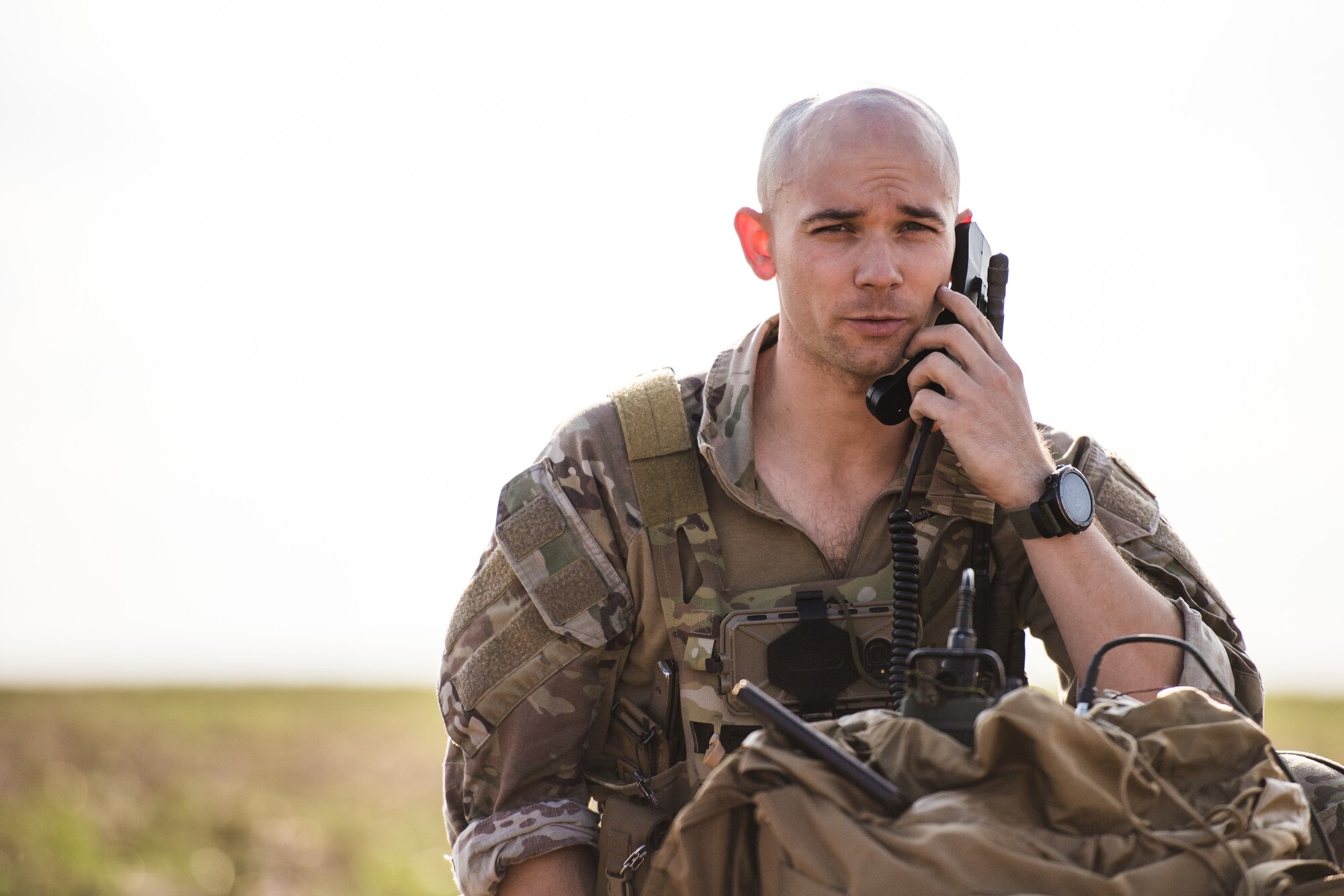 Photo of Airman using communications equipment