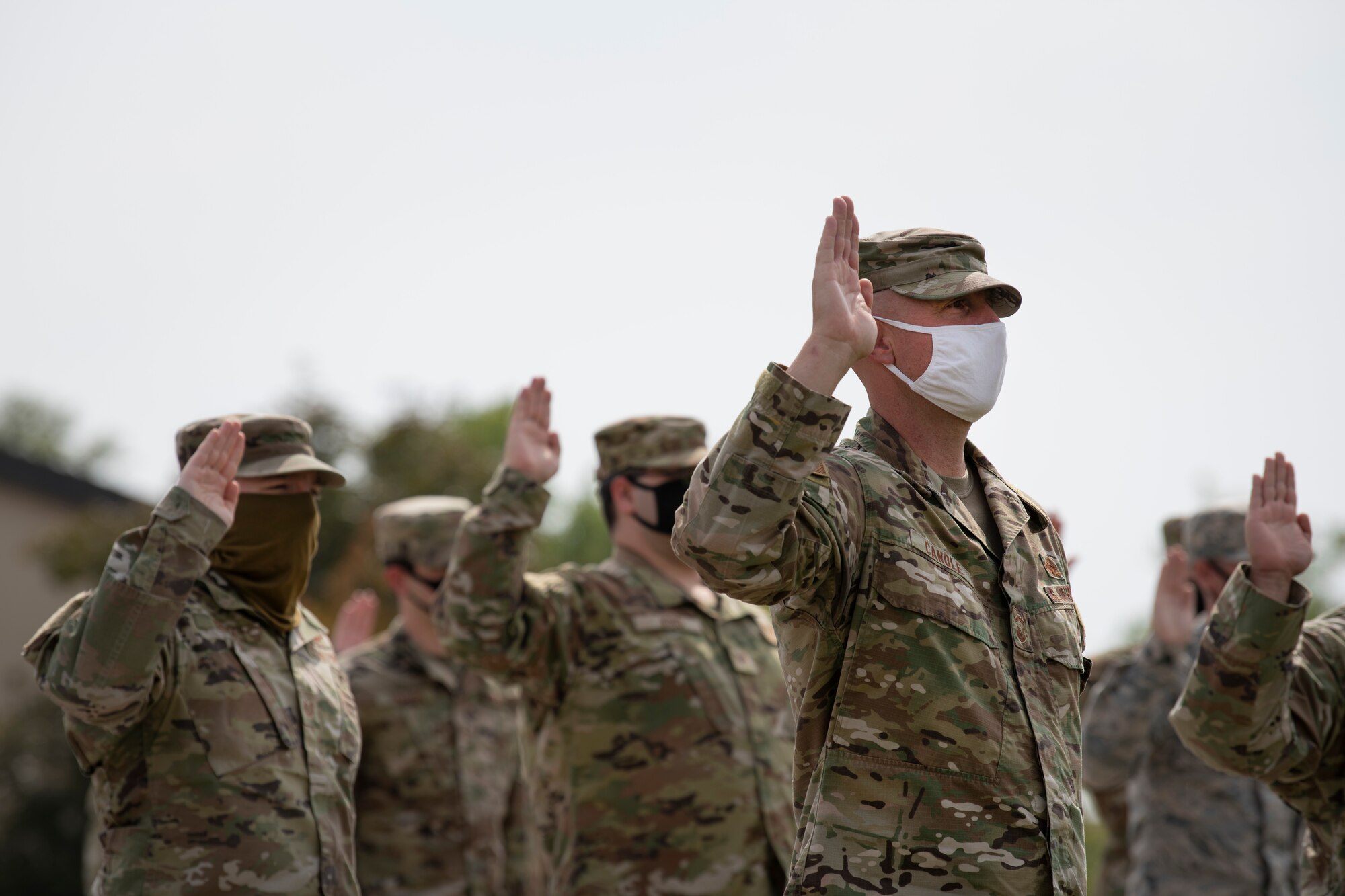 Delta 2 members recite the oath of enlistment and office during a transfer ceremony