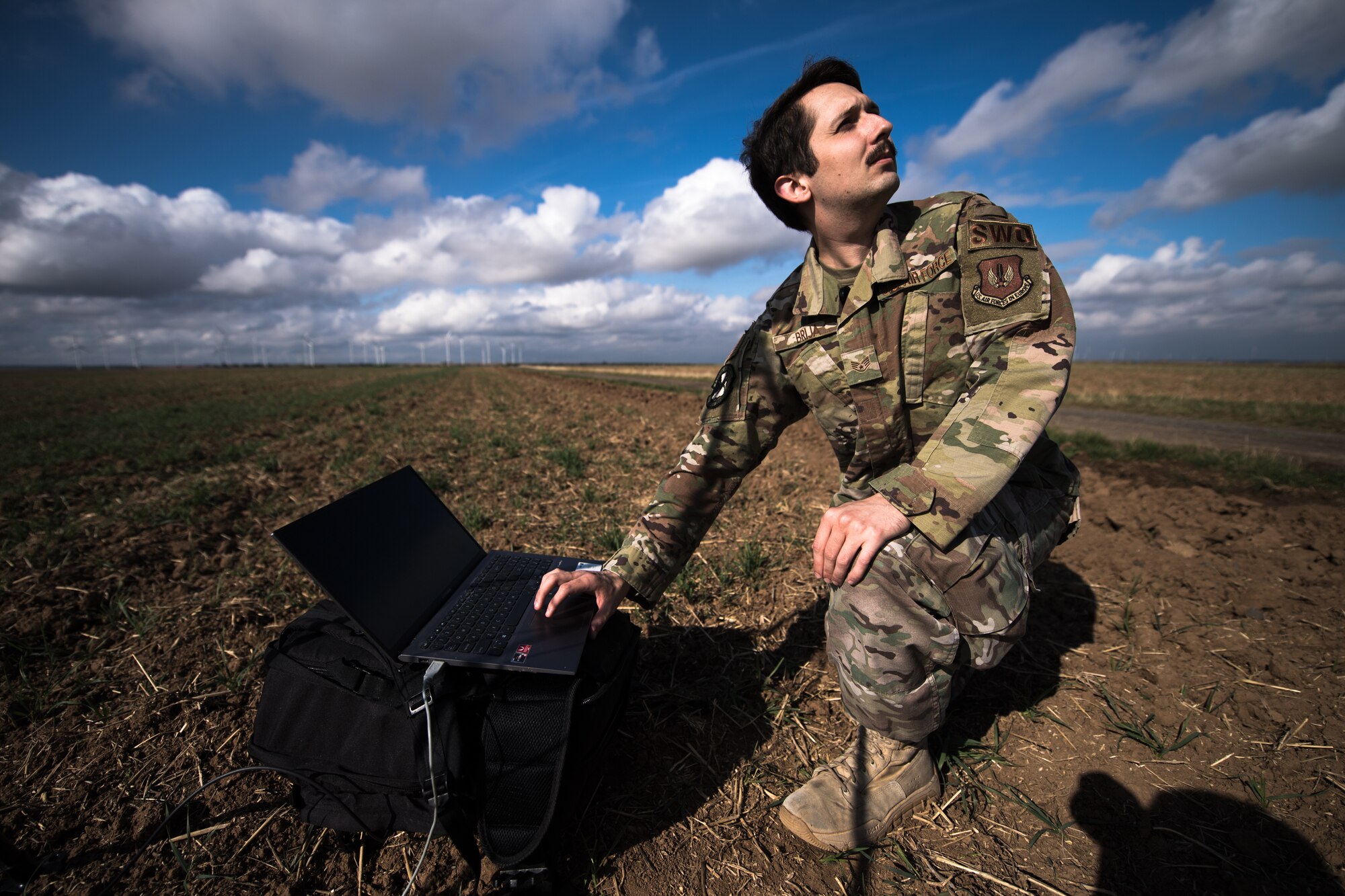 Photo of Airman forecasting weather in a field
