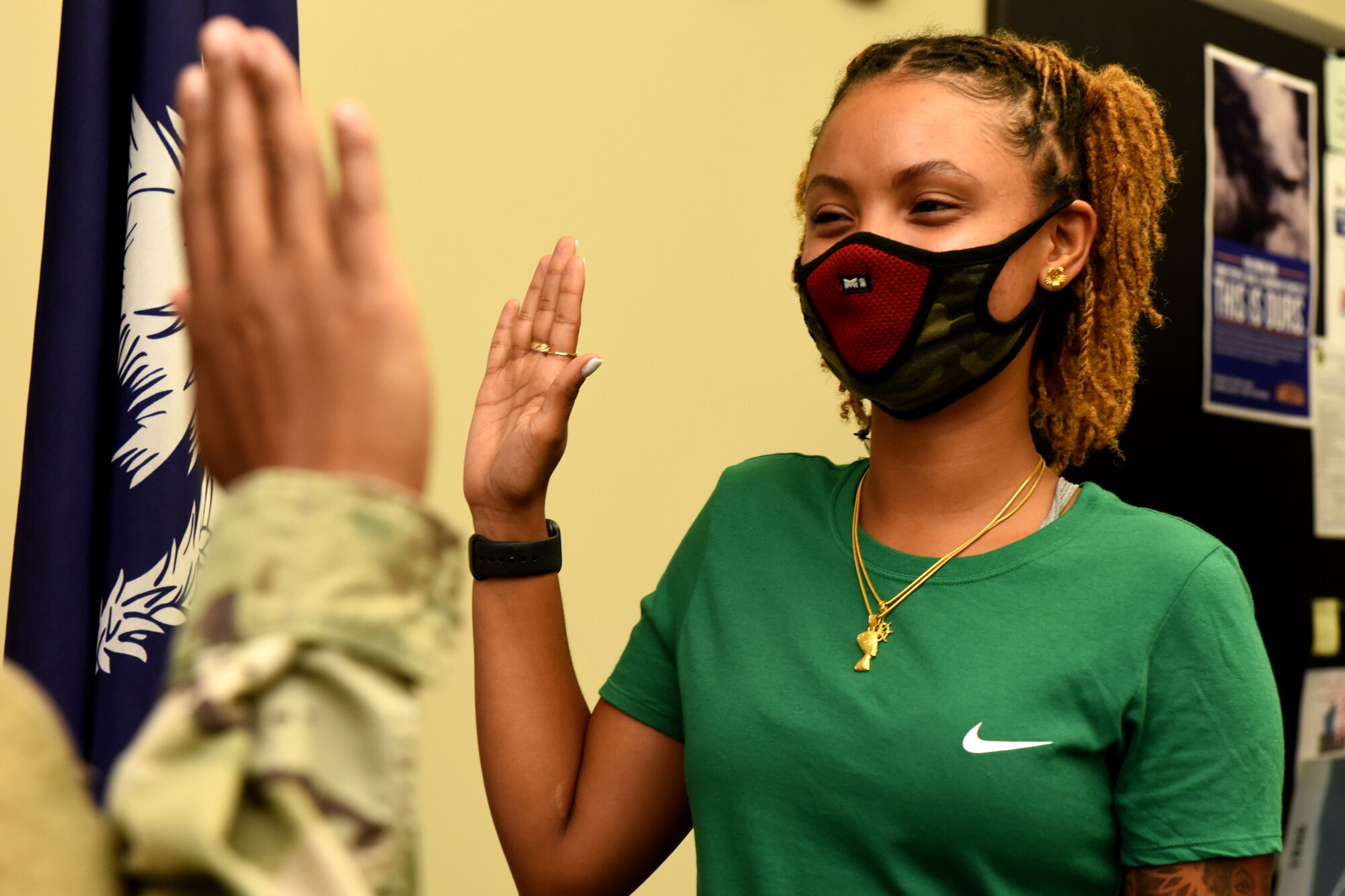 Oniyah Meadows, a new recruit for the South Carolina Air National Guard, performs her enlistment into the South Carolina Air National Guard's 169th Fighter Wing at the Joint Armed Forces Reserve Center on McEntire Joint National Base, August 19, 2020. Due to COVID-19, the recruitment and retention team of the South Carolina Air National guard have converted to a more virtual approach to recruits and participate in the proper health and safety precautions when interacting face-to-face. (U.S. Air National Guard photo by Senior Airman Mackenzie Bacalzo)