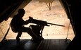 A U.S. Marine fires an M2 .50-caliber machine gun from a CH-53E Super Stallion in Yuma, Ariz., Oct. 3.