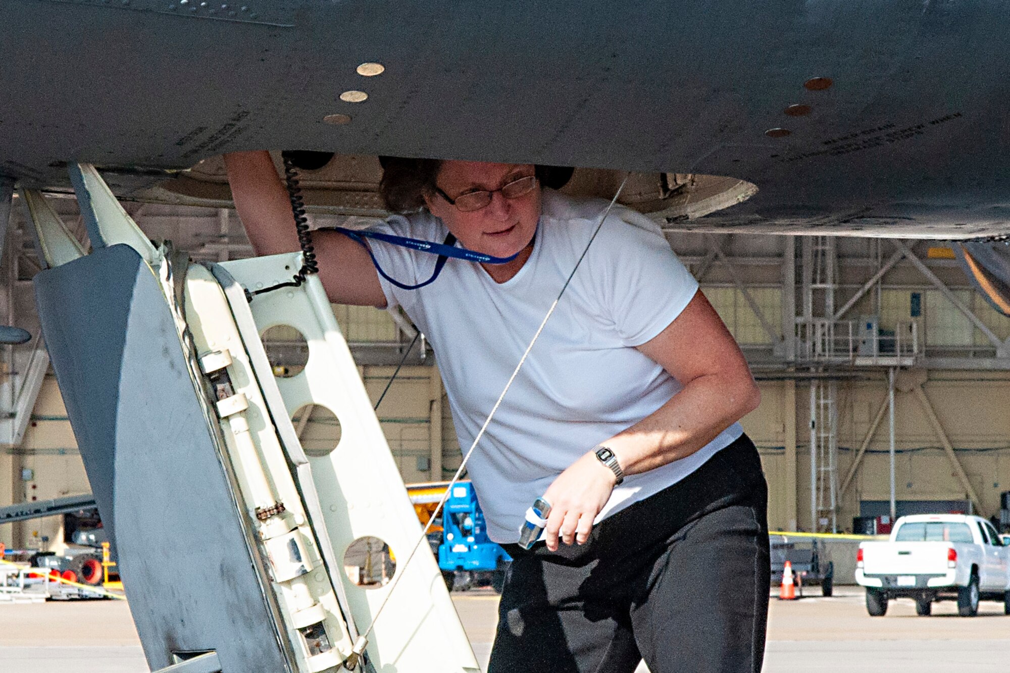 Photo of woman exiting B52 Stratofortress.