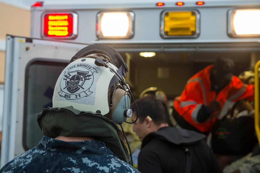 170907-N-TI017-205
CARIBBEAN SEA (Sept. 7, 2017) Cmdr. Gregory Freitag, officer in charge of Fleet Surgical Team 2 (FST-2), supervises the loading of evacuees into an ambulance as part of first response efforts to the U.S. Virgin Islands in the wake of Hurricane IRMA.
