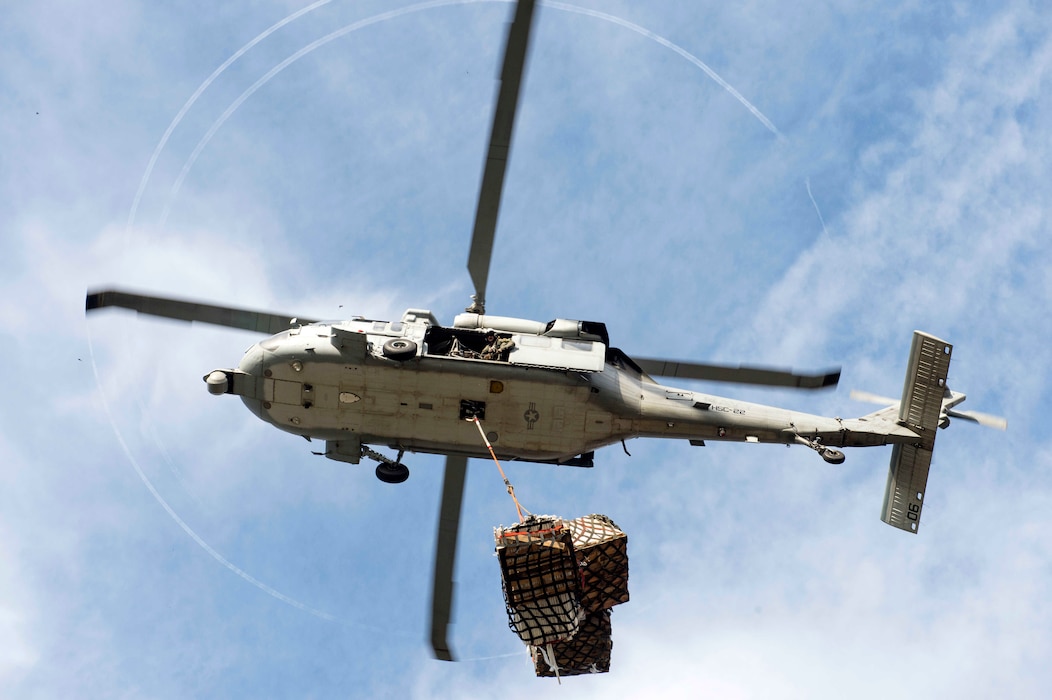 150708-N-XQ474-024 BUENAVENTURA, Colombia (July 8, 2015) An MH-60S Sea Hawk helicopter, assigned to Helicopter Sea Combat Squadron 22 Sea Knights, transports cargo in support of Continuing Promise 2015
