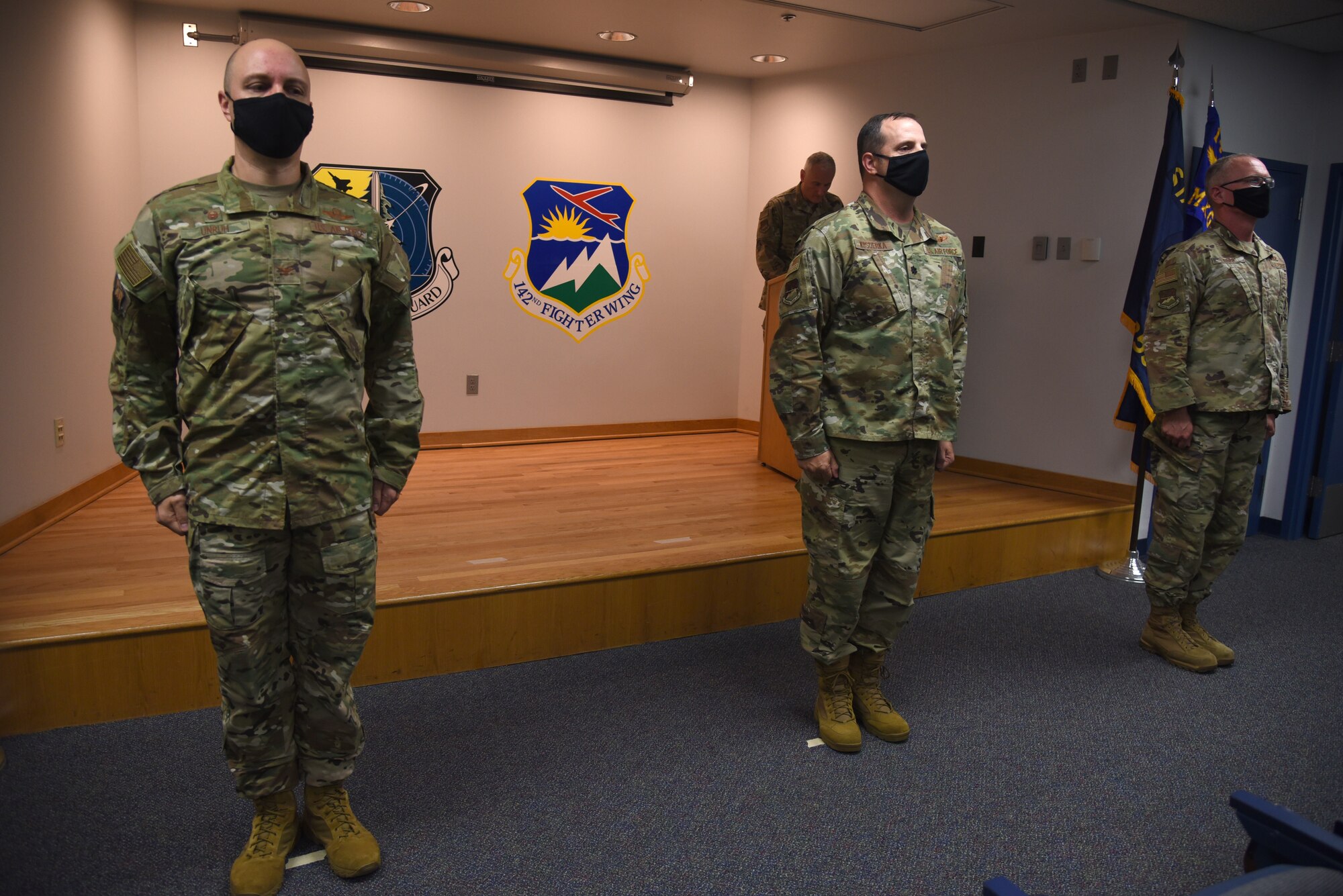 U.S. Air Force Lt. Col. Michael Kosderka, center, assumes command of the 142nd Maintenance Group from Col. William Kopp, right, during a change of command ceremony at Portland Air National Guard Base, Ore., Oct. 1, 2020. Kopp took over as the 142nd Wing Vice Commander. Col. David Undruh, 142nd Wing Commander, left, presided over the ceremony. (U.S. Air National Guard Photo by Senior Airman Valerie R. Seelye)