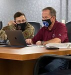 Retired Gen. David L. Goldfein, the 21st Chief of Staff of the U.S. Air Force, goes over paperwork with Tech. Sgt. Steven Daniels from the 502nd Comptroller Squadron Sept. 30. A command pilot with more than 4,200 flight hours, Goldfein served 37 years in the Air Force and is retiring to the San Antonio area.