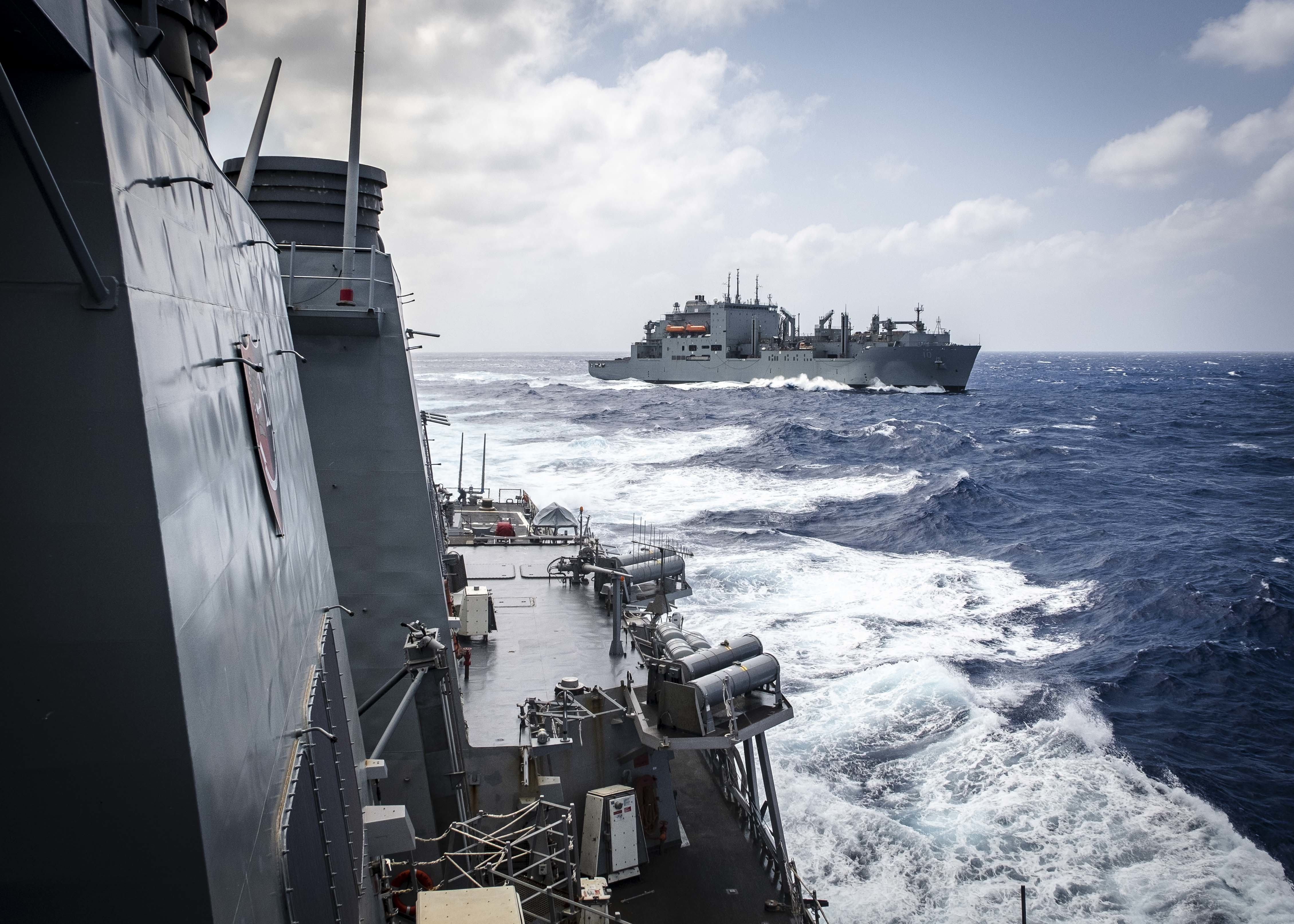 USS John S. McCain (DDG 56) sails away after conducting a replenishment-at-sea with the Lewis and Clark-class dry cargo and ammunition ship USNS Charles Drew (T-AKE 10).
