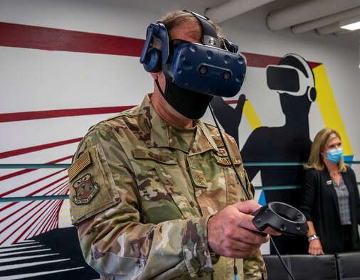 Maj. Gen. Thad Bibb, 18th Air Force commander, uses a virtual reality system during his tour of the new Bedrock facility at Dover Air Force Base, Delaware, Sept. 23, 2020. The Bedrock facility provides a collaborative environment in which Airmen can explore their creativity and generate intelligent failures that will ultimately lead to success and better answers to future challenges. (U.S. Air Force photo by Senior Airman Christopher Quail)