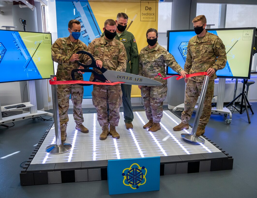 Col. Mathew Jones, 436th Airlift Wing commander, cuts a ribbon, marking the opening of the new Bedrock facility, Sept. 23, 2020, at Dover Air Force Base, Delaware. The Bedrock facility provides a collaborative environment in which Airmen can explore their creativity and generate intelligent failures that will ultimately lead to success and better answers to future challenges. (U.S. Air Force photo by Senior Airman Christopher Quail)