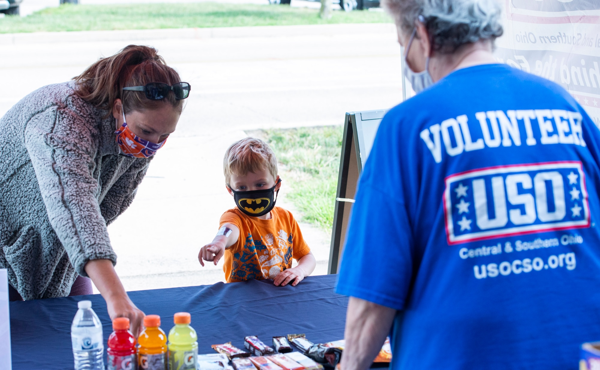 Attendees check out the variety available during the "USO-To-Go" soft-reopening event at Wright-Patterson Air Force Base.