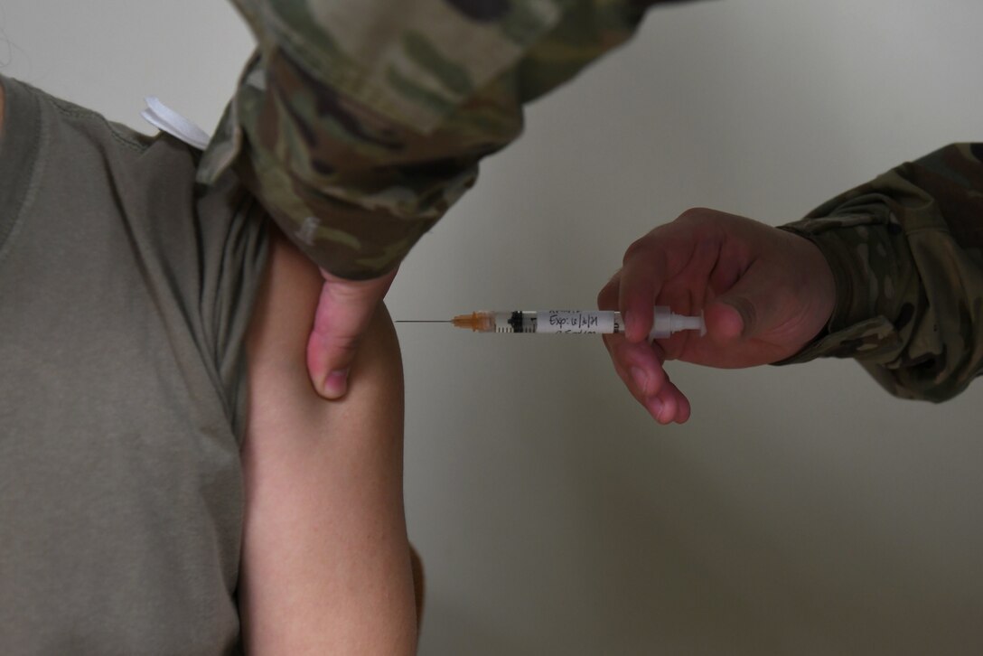 An annual flu shot is administered to a service member at the 30th Medical Group, Sept. 25, 2020, at Vandenberg Air Force Base, Calif.