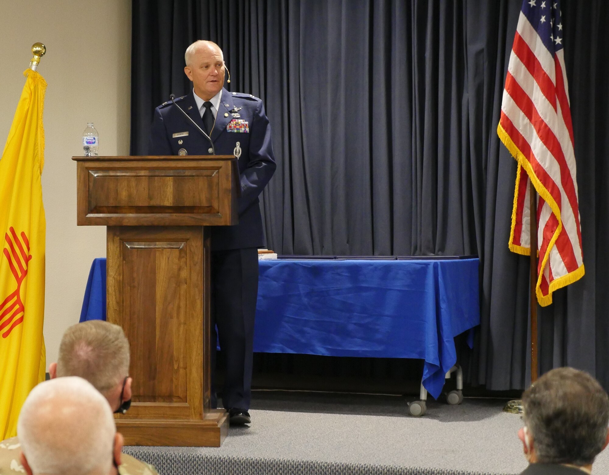 air force colonel stands at lectern