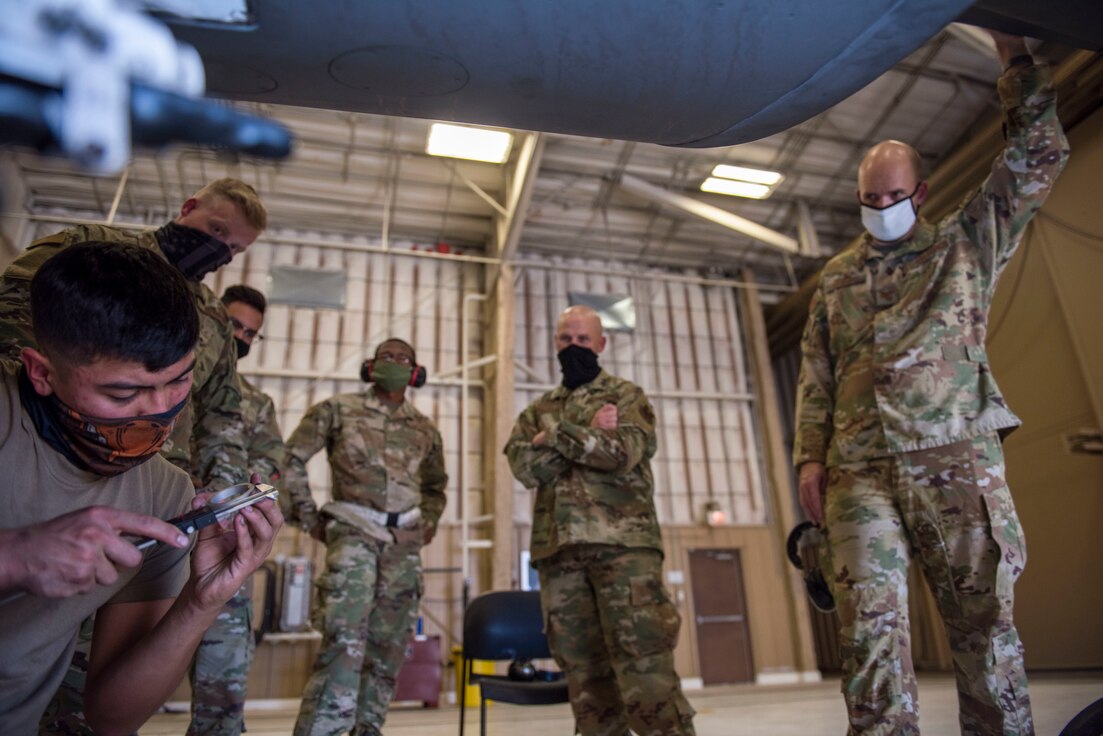 (From right to left) Col. Ryan Keeney, 49th Wing commander, Chief Master Sgt. Thomas Temple, 49th Wing command chief, and 372nd Training Squadron, Detachment 10 Airmen, observe Airman 1st Class Tristen Estrada, 372nd TRS Det 10 student, change a tire on an F-16 Viper, Oct. 15, 2020, on Holloman Air Force Base, New Mexico. The 372nd TRS Det 10 offers a 6-week on-the-job training course following technical training for maintenance Airmen to advance their skills before reaching their first base assignment. (U.S. Air Force photo by Airman 1st Class Quion Lowe)